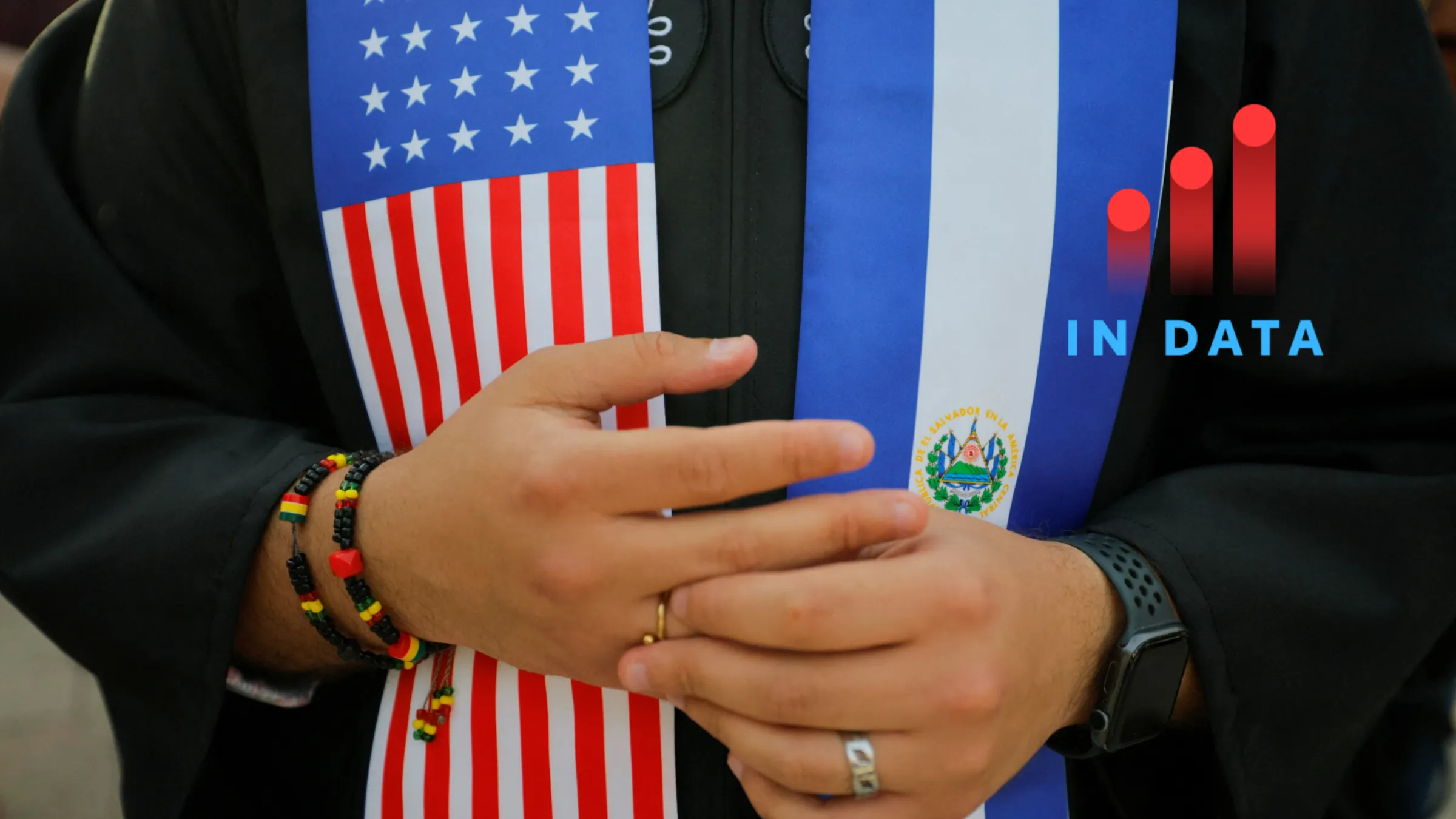 A person wears a stole with the flags of U.S. and El Salvador as members of the Harvard community take part in a 'Harvard Stand United' rally to 'support and celebrate' the school's international students at Harvard University in Cambridge, Massachusetts, U.S., May 27, 2025. REUTERS/Brian Snyder