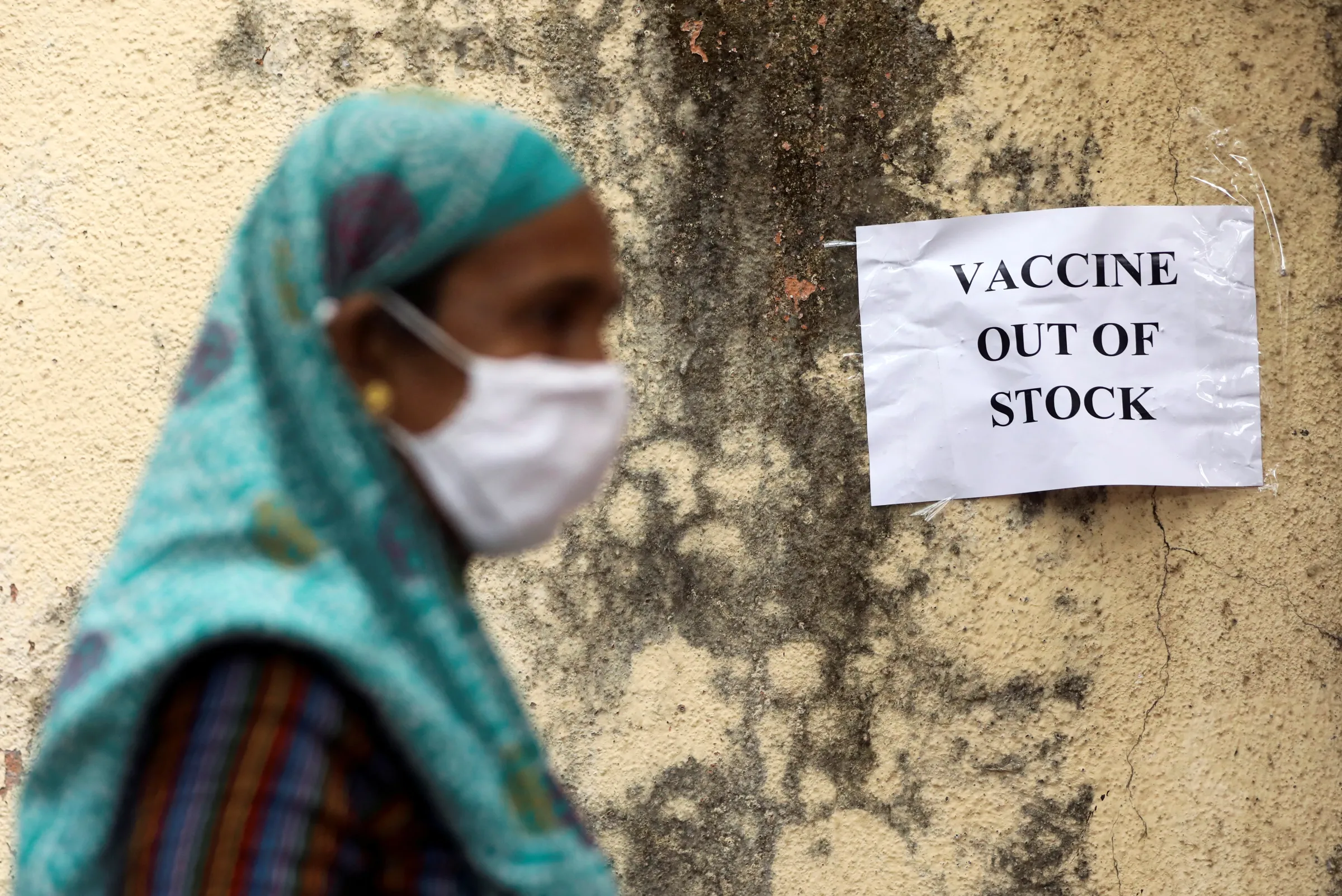 A notice about the shortage of coronavirus disease (COVID-19) vaccine supplies is seen at a vaccination centre, in Mumbai, India, April 8, 2021. REUTERS/Francis Mascarenhas