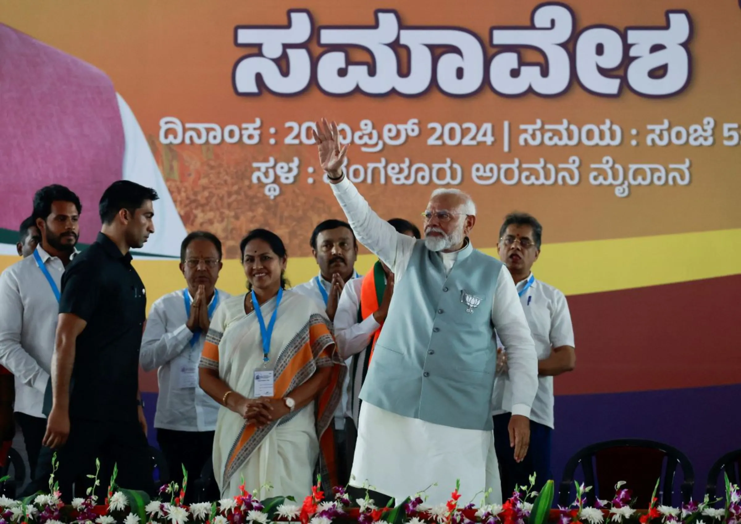 India's Prime Minister Narendra Modi waves towards his supporters as he arrives to attend an election campaign in Bengaluru, Karnataka, India, April 20, 2024. REUTERS/Navesh Chitrakar