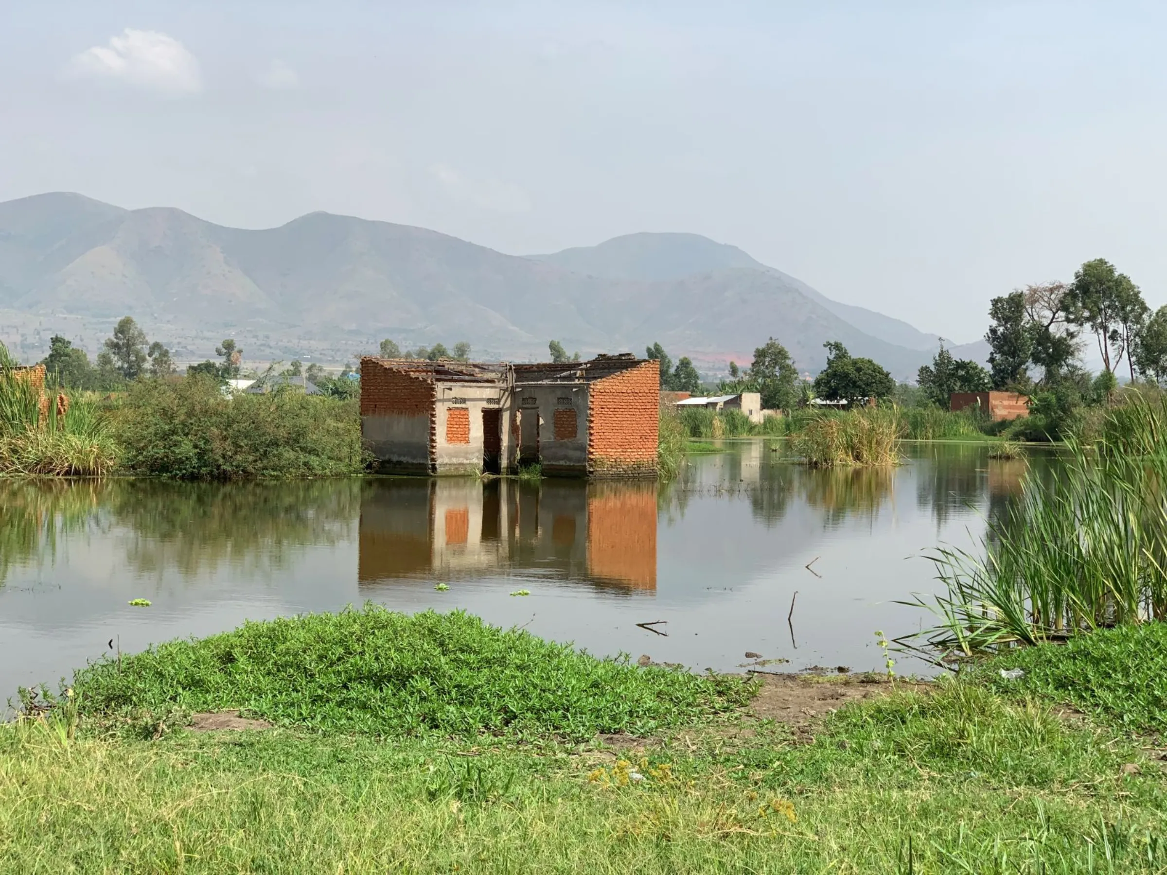 A view of a flooded and abandoned home near the Nyamwamba River