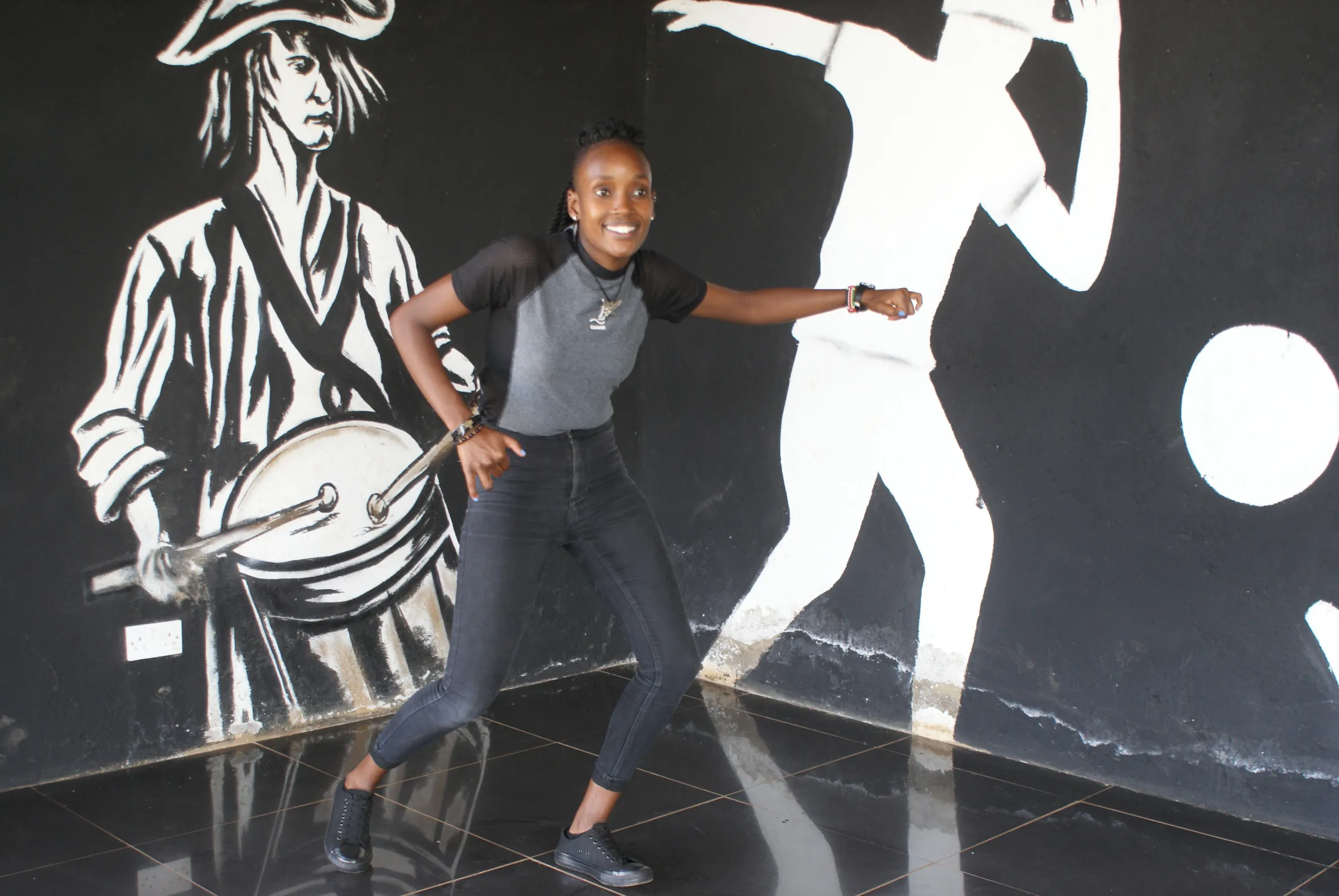 Choreographer Big Mich dances at Kibera slum in Nairobi, Kenya. February 17, 2022. Thomson Reuters Foundation/Kagondu Njagi.