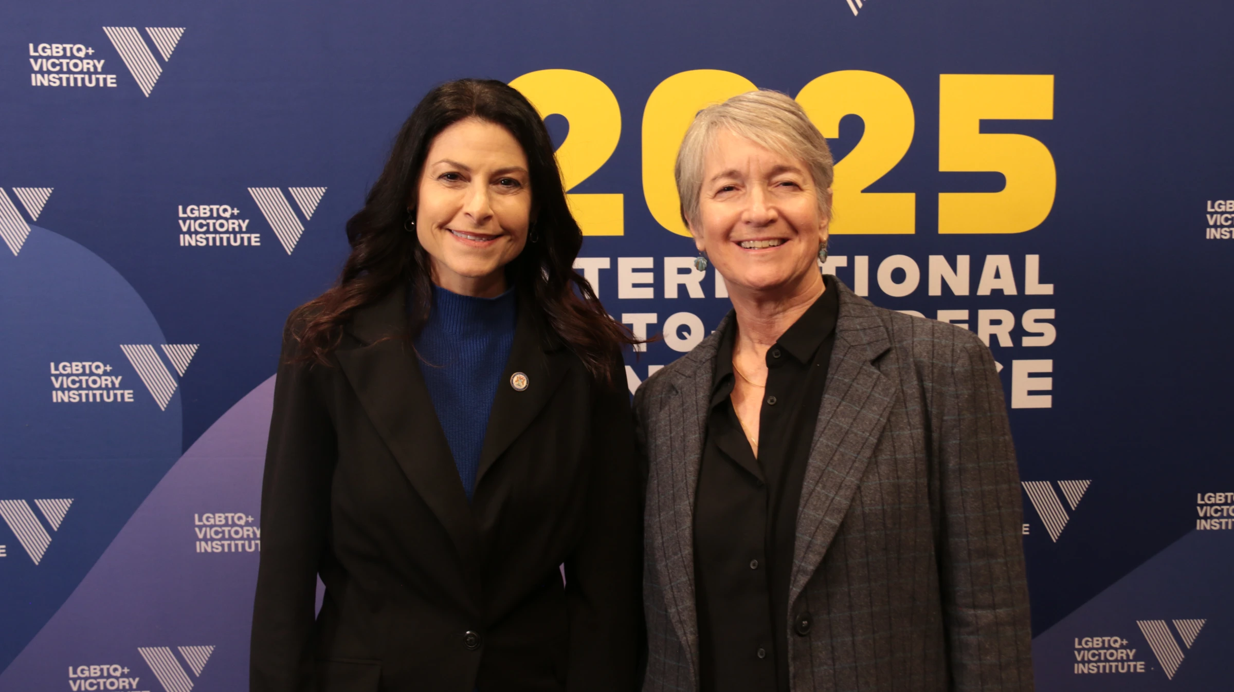 Michigan Attorney General Dana Nessel (left) pictured with Hawaii Attorney General Anne E. Lopez at the 2025 International LGBTQ+ Leaders Conference in Washington DC on December 5. Lucy Middleton/Thomson Reuters Foundation