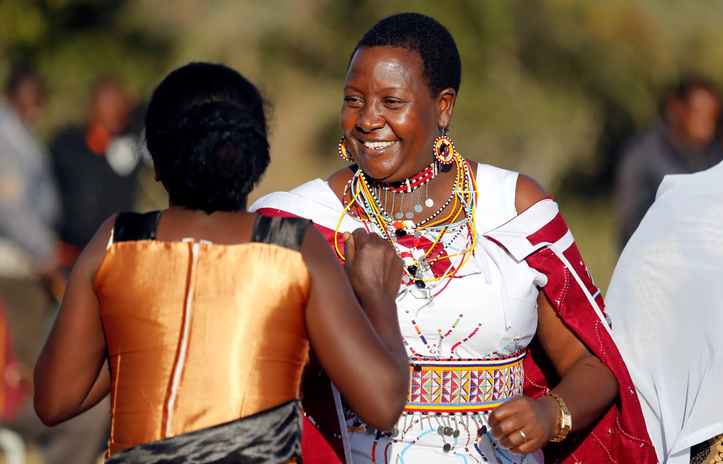 Kajiado East Member of Parliament Peris Tobiko dances with a supporter during her campaign rally