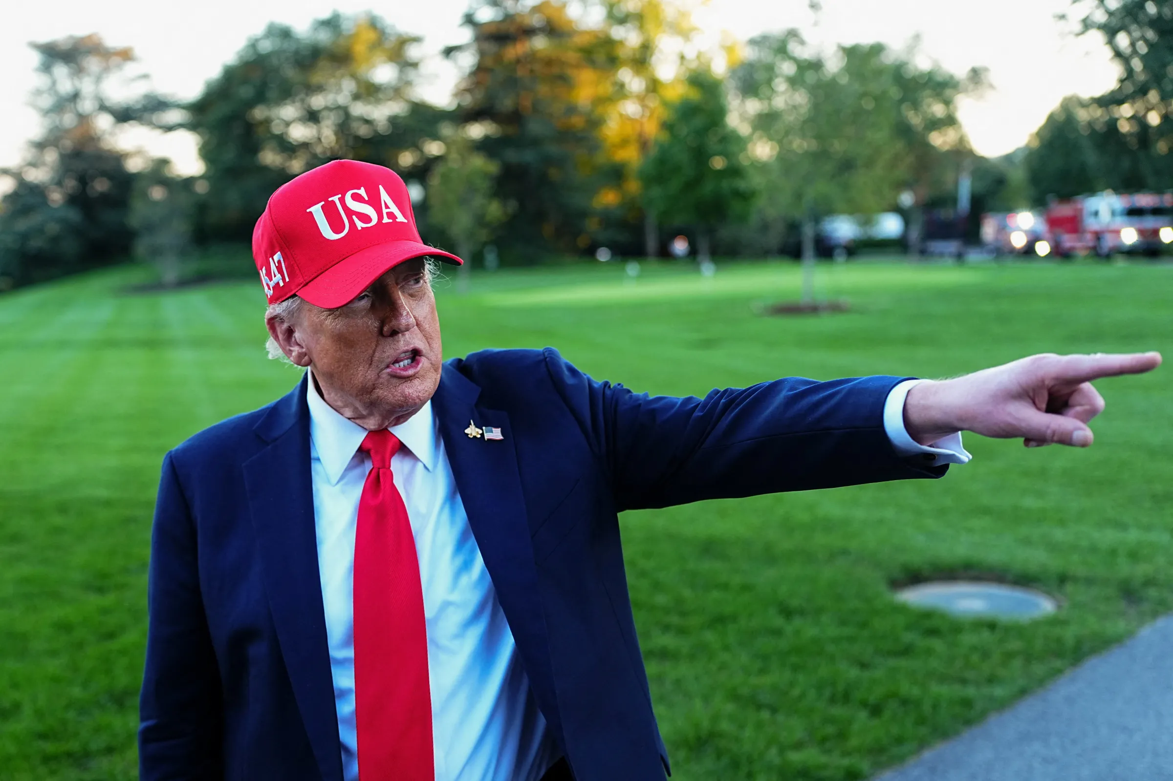 U.S. President Donald Trump points a finger as he speaks to members of the media upon his arrival at the White House in Washington, D.C., U.S., October 5, 2025. REUTERS/Aaron Schwartz