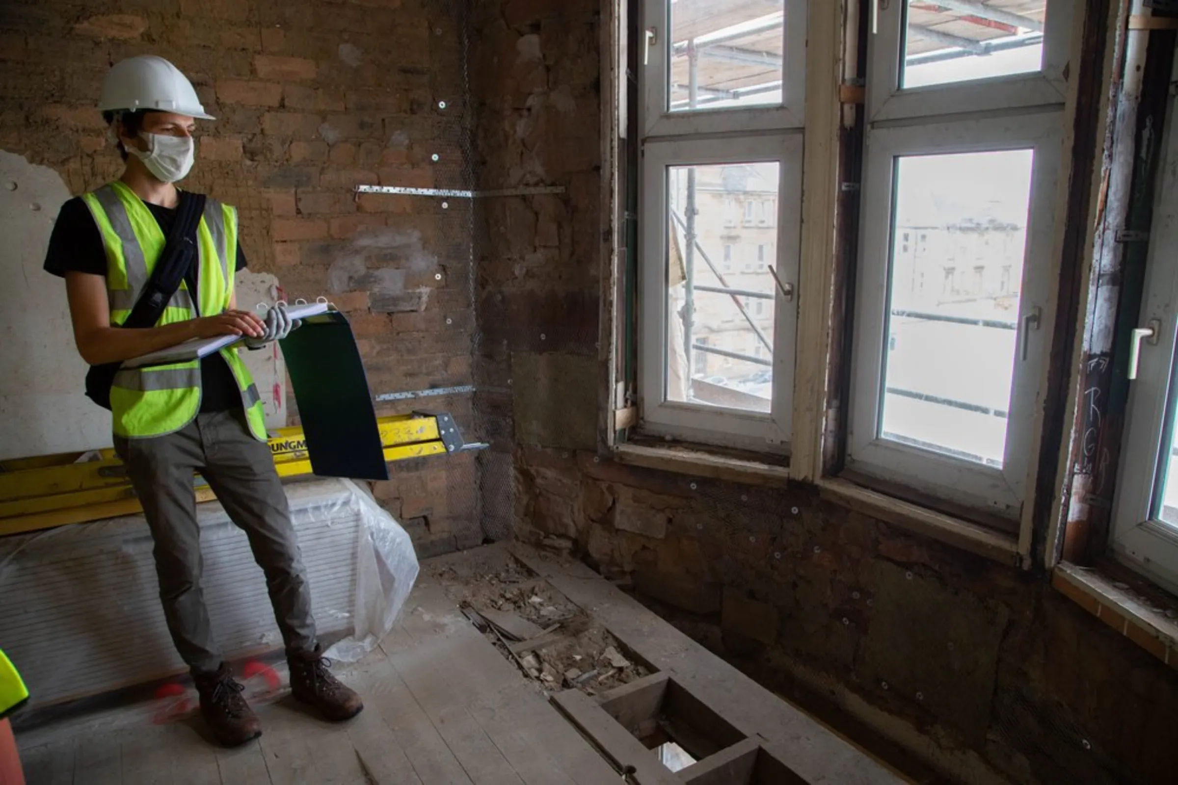 Drew Carr shows a traditional bay window in a tenement flat in Glasgow, United Kingdom, July 23, 2021. Using insulation and triple-glazing the notoriously drafty windows can be refitted to a higher energy efficiency standard without compromising the traditional facade, Carr said