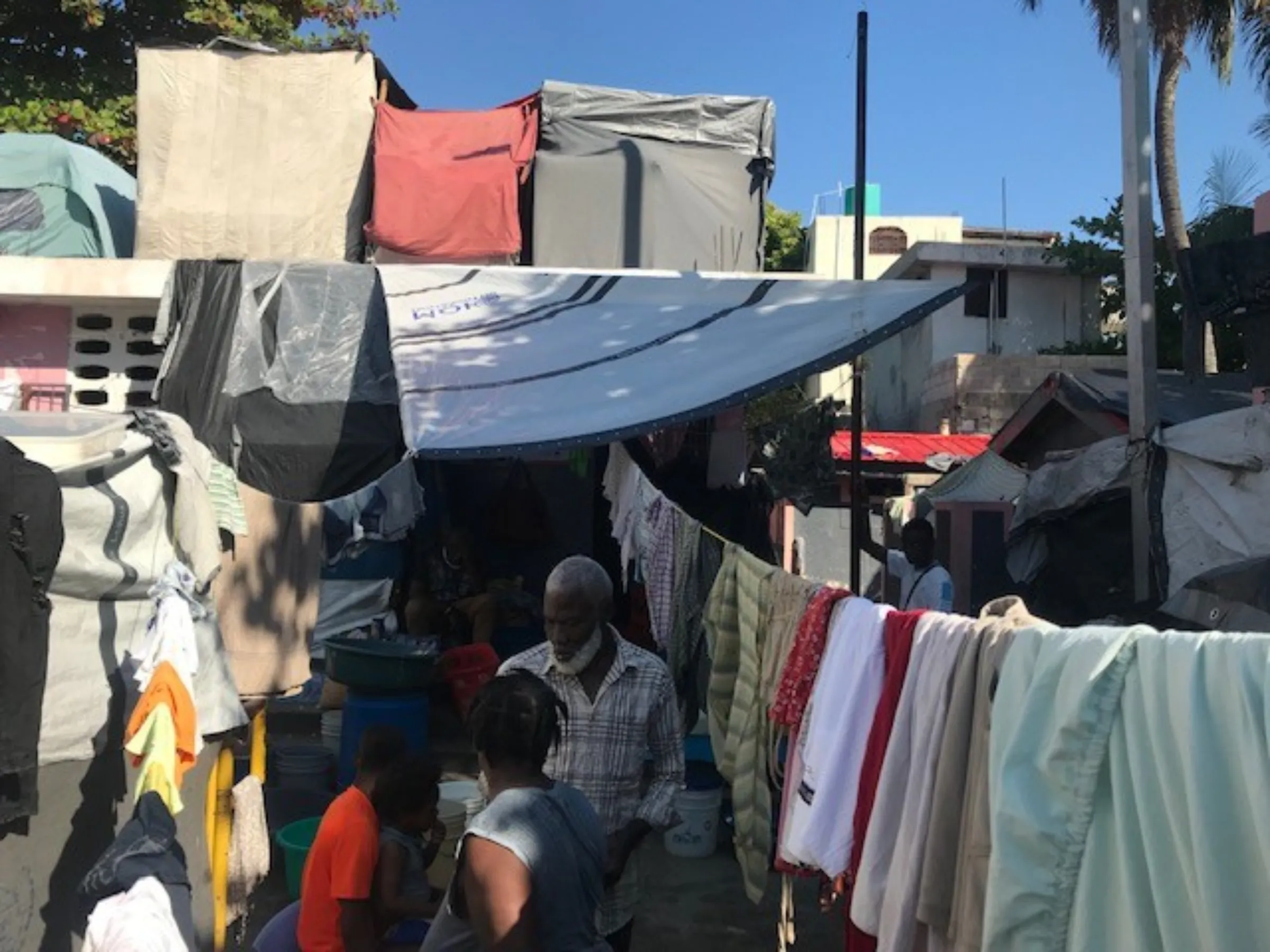Haitians displaced by gang violence living in tents at the Darius Denis camp in Lalue, Port-au-Prince, Haiti. March 7, 2025. Thomson Reuters Foundation/Joseph Guyler Delva
