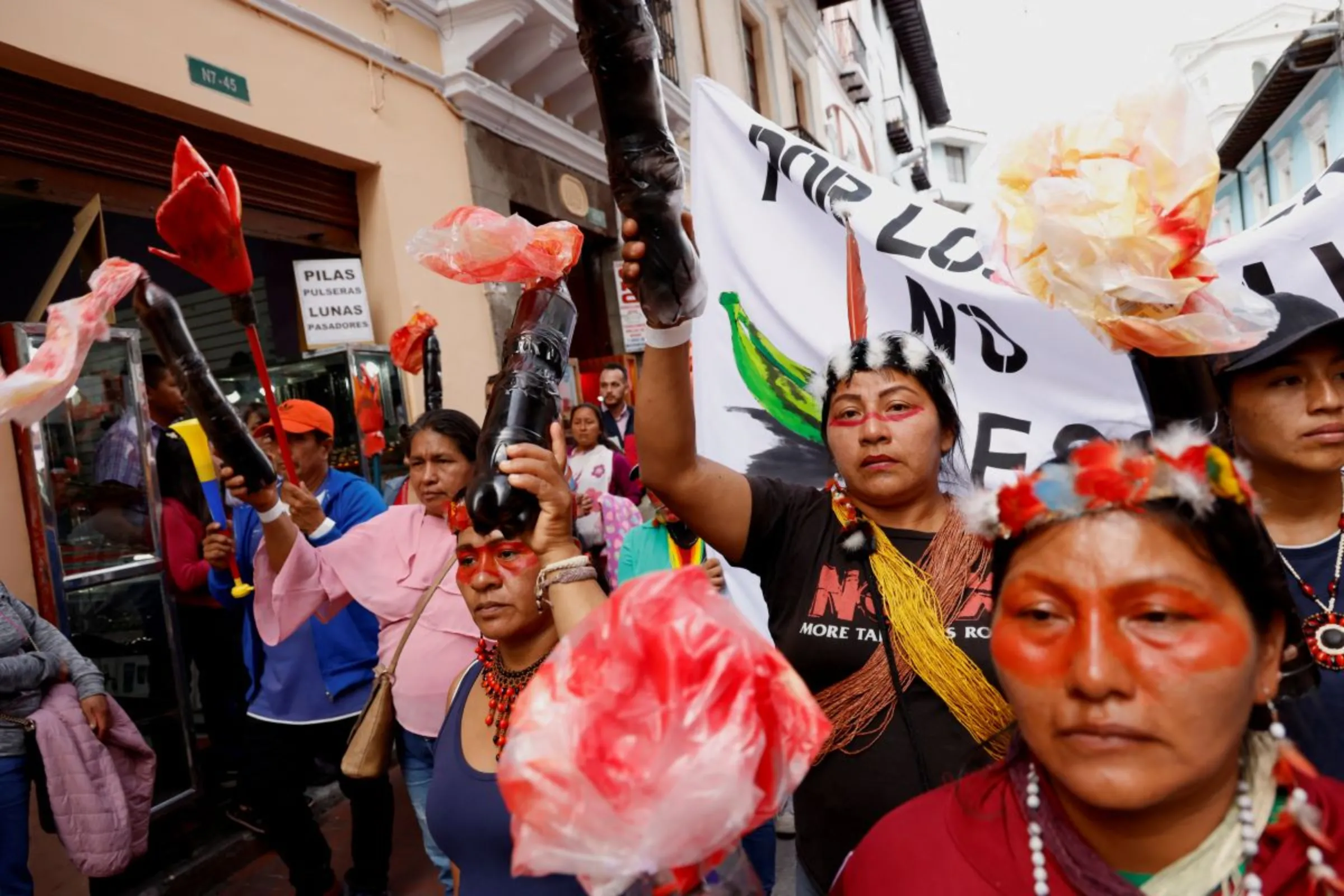 Members of Ecuadorean indigenous communities march demanding that the government comply with court orders to halt the use of hundreds of gas flares by oil producers in the country's Amazon, in Quito, Ecuador March 12, 2024. REUTERS/Karen Toro