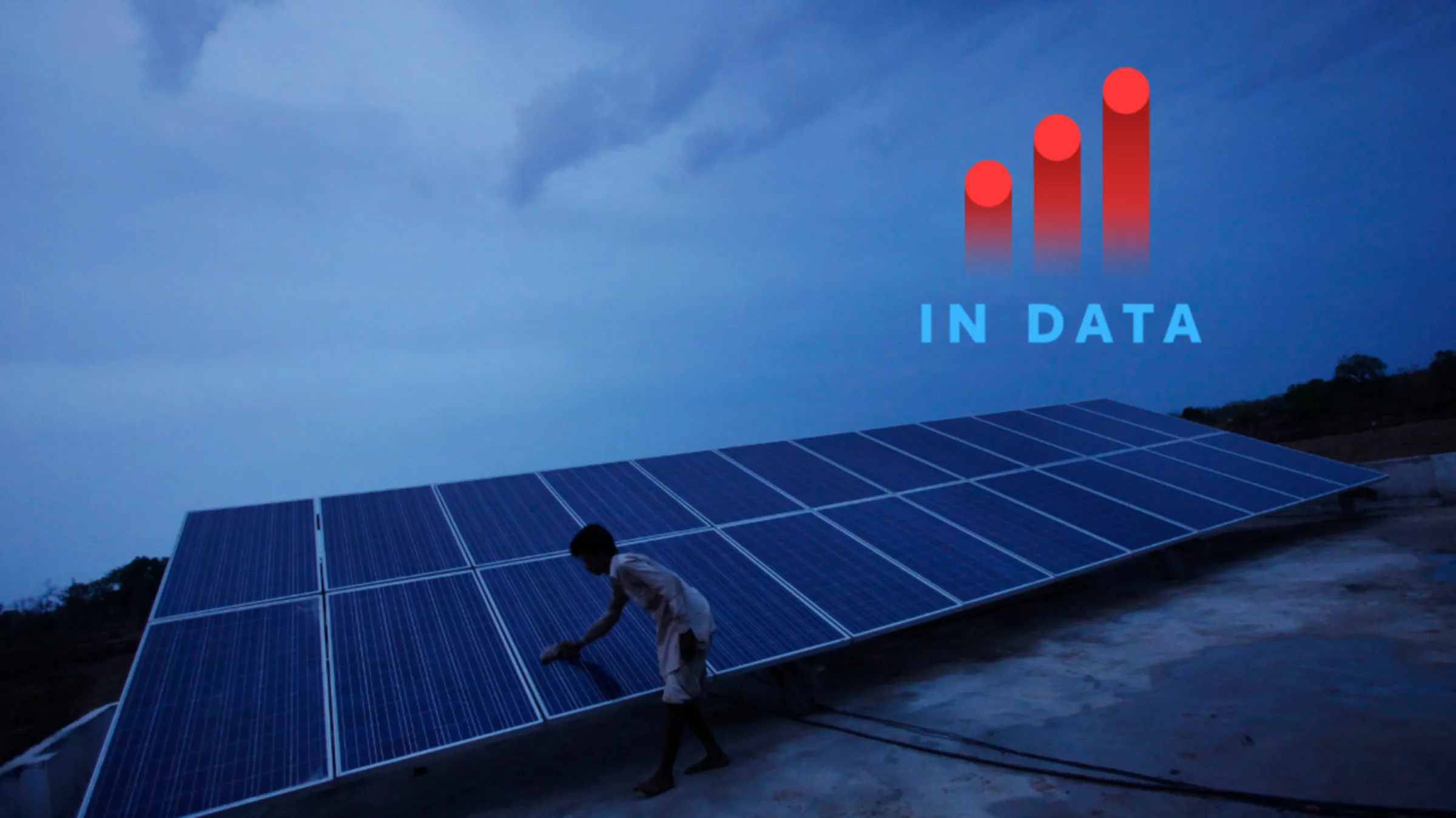 A man cleans panels installed at a solar plant at Meerwada village of Guna district in the central Indian state of Madhya Pradesh June 18, 2012. REUTERS/Adnan Abidi