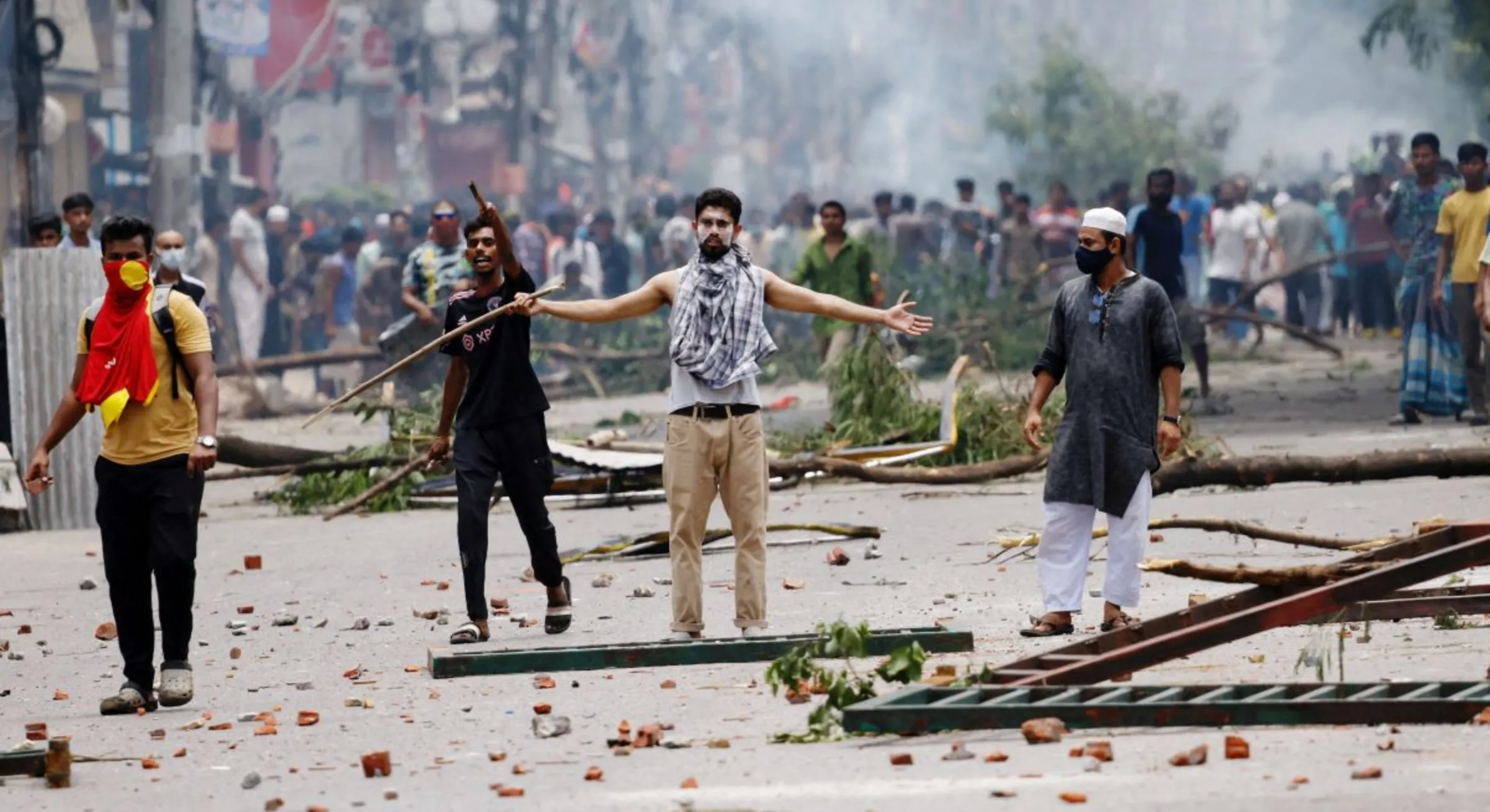 A demonstrator gestures as protesters clash with Border Guard Bangladesh and the police as violence erupts across the country after anti-quota protests by students, in Dhaka, Bangladesh, July 19, 2024. REUTERS/Mohammad Ponir Hossain