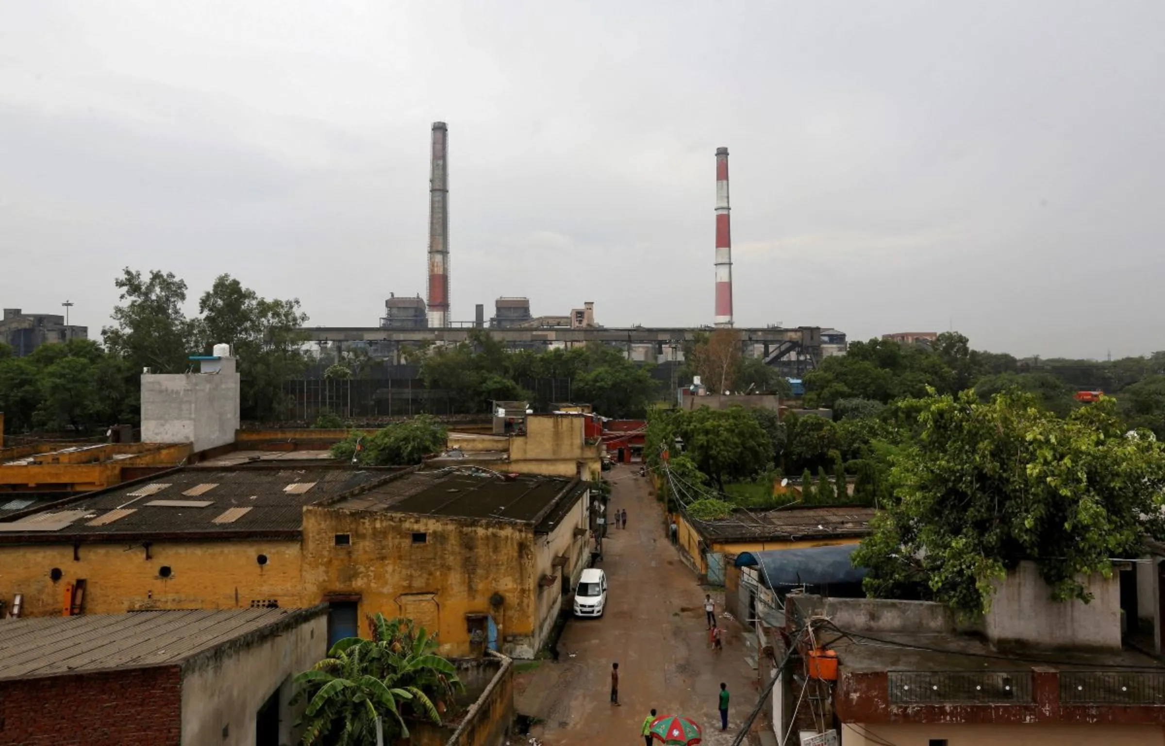 Chimneys of a coal-fired power plant are pictured in New Delhi, India, July 20, 2017. REUTERS/Adnan Abidi