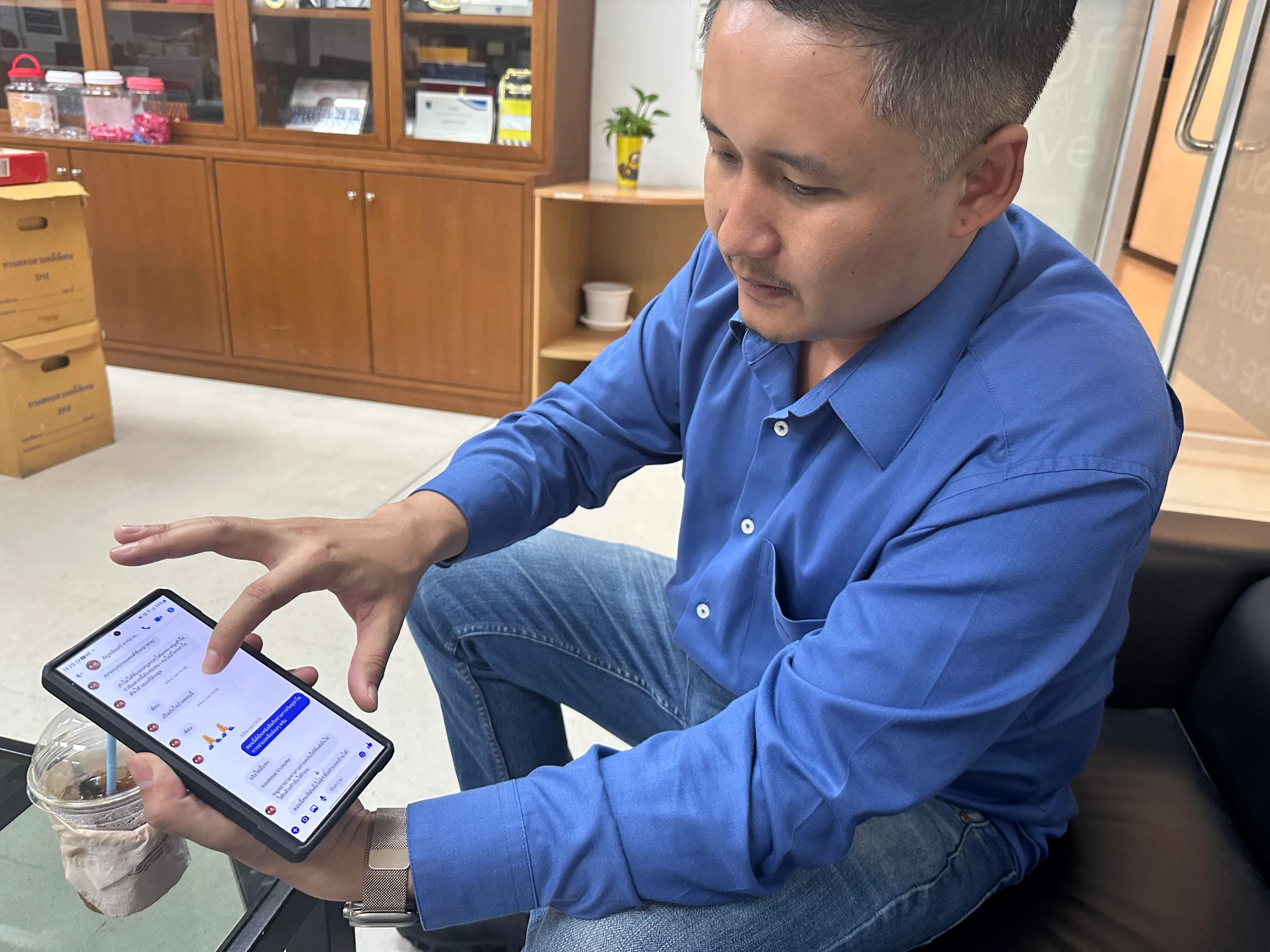 Jaruwat Jinnmonca, founder of Immanuel Foundation, received numerous messages everyday from people trapped inside scam centres looking for help, March 11, 2025. Thomson Reuters Foundation/Rebecca L Root