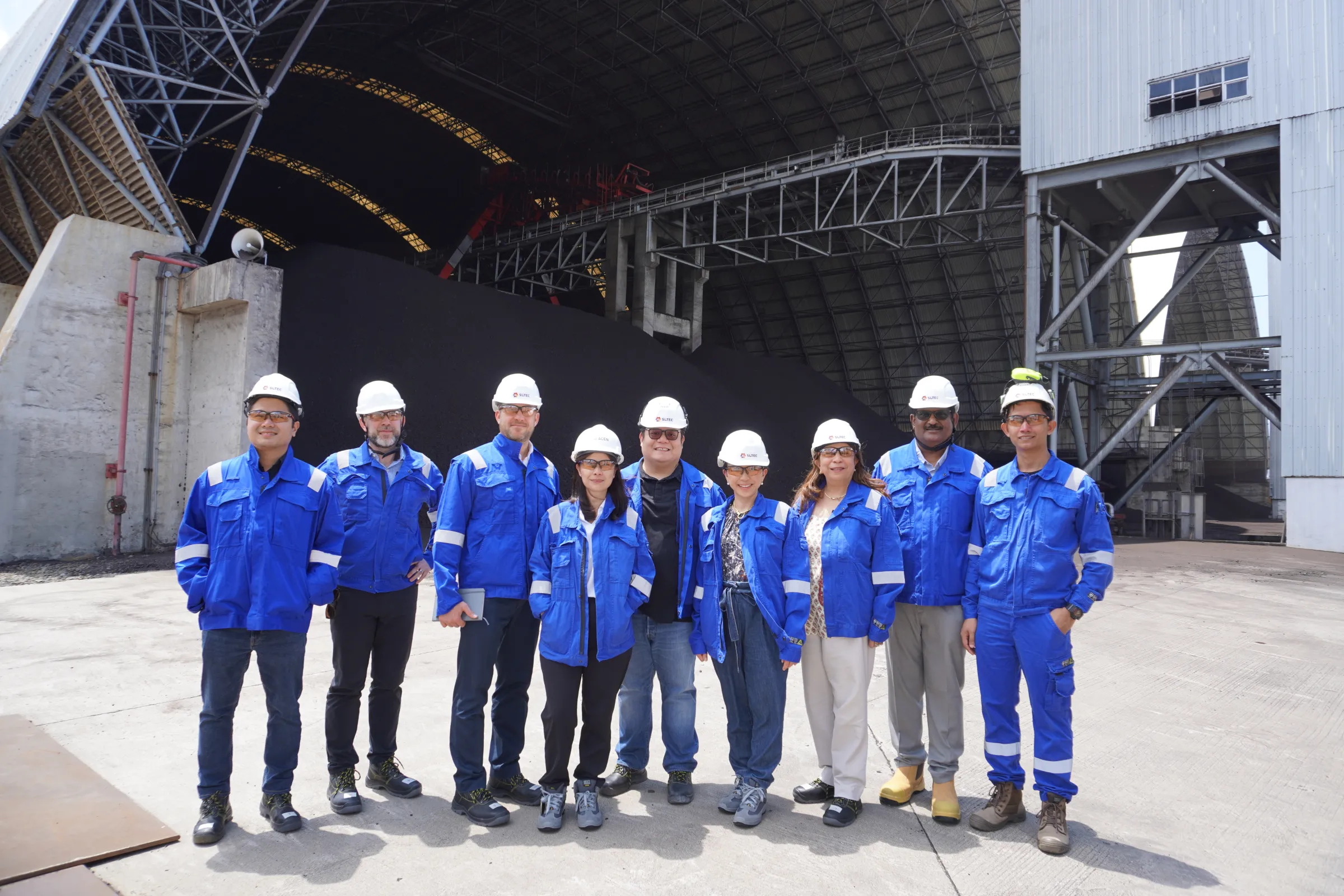 Joseph Curtin (second from the left) poses for a photograph with other representatives from the The Rockefeller Foundation at the South Luzon Thermal Energy Corporation plant in Batangas, Philippines, April 20, 2024. The Rockefeller Foundation/Handout via Thomson Reuters Foundation