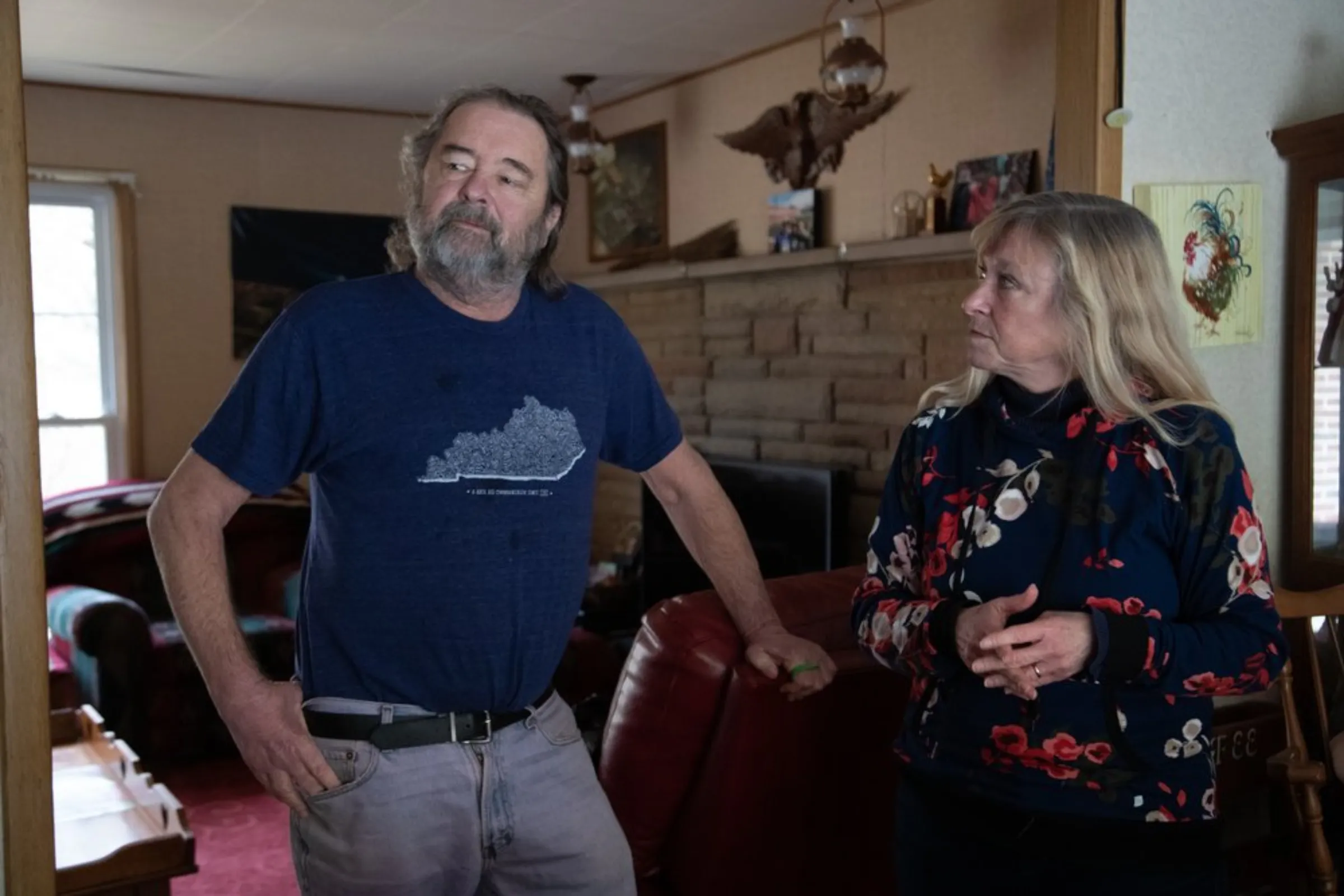 Environmental activists Micky and Nina McCoy stand in their home in Inez, Kentucky, January 24, 2022. Thomson Reuters Foundation/Amira Karaoud