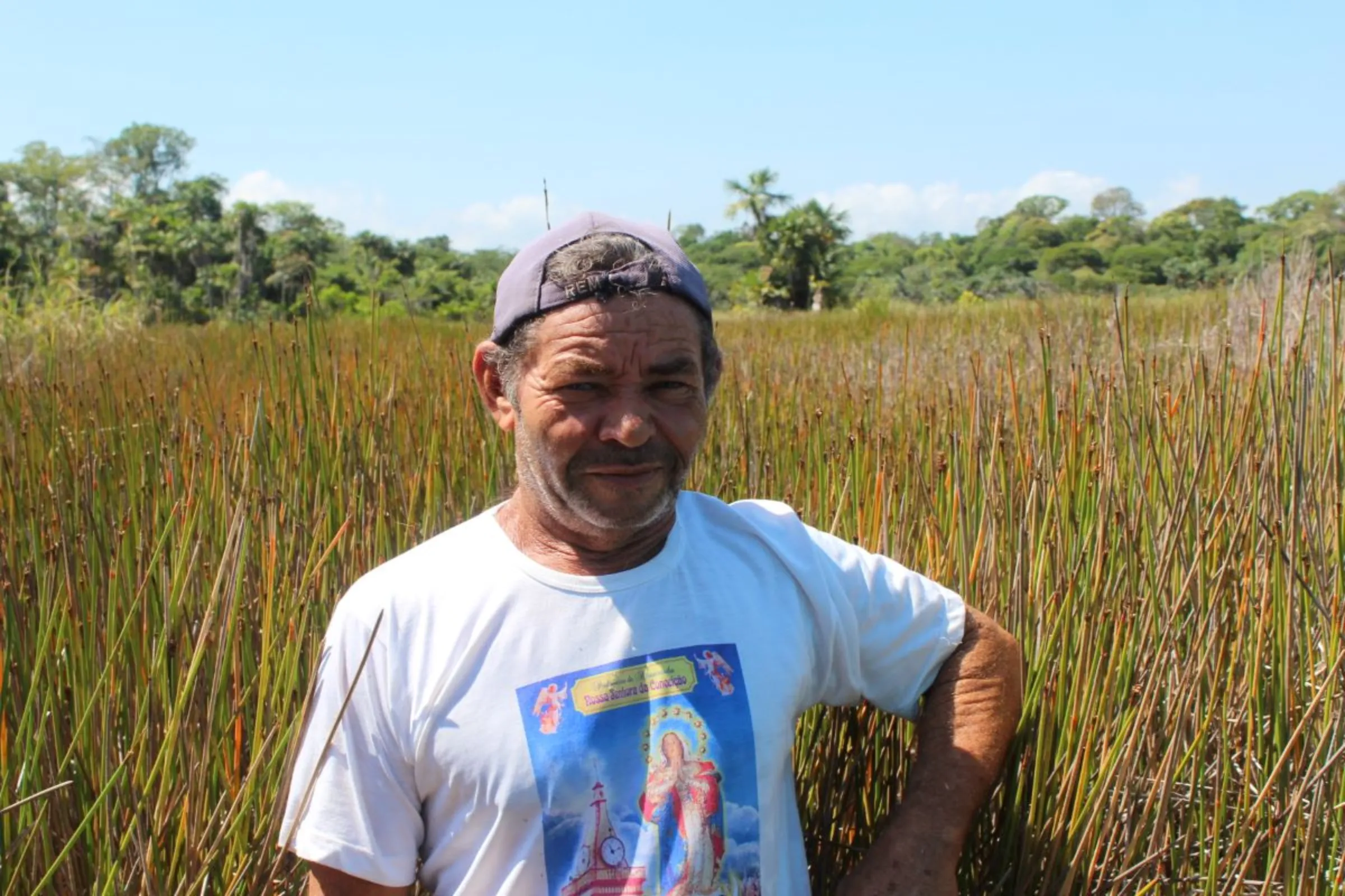 Fisherman José Rosivaldo Rodrigues Cardozo, by Piri lakes on the Xingu Island, Brazil on August 12, 2023. The lakes are part now partially enclosed by fence posts marking land claimed by the U.S. grain giant Cargill. Thomson Reuters Foundation /André Cabette Fábio