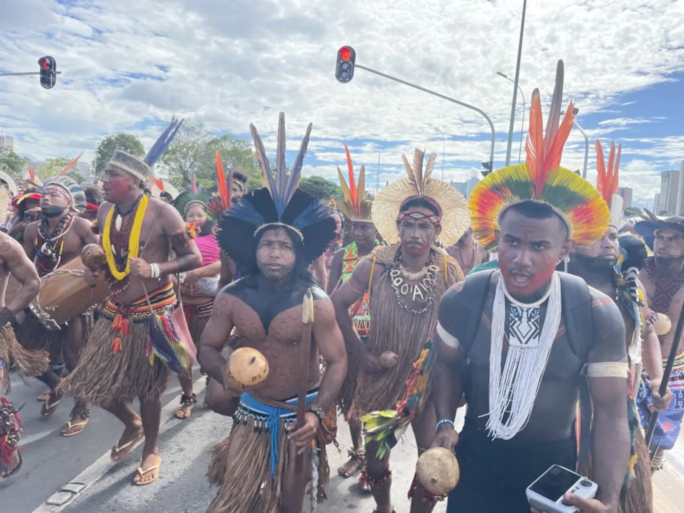 Indigenous people at a march during the Free Land Camp (ATL) in Brasília, Brazil, April 2023. Thomson Reuters Foundation/André Cabette Fábio