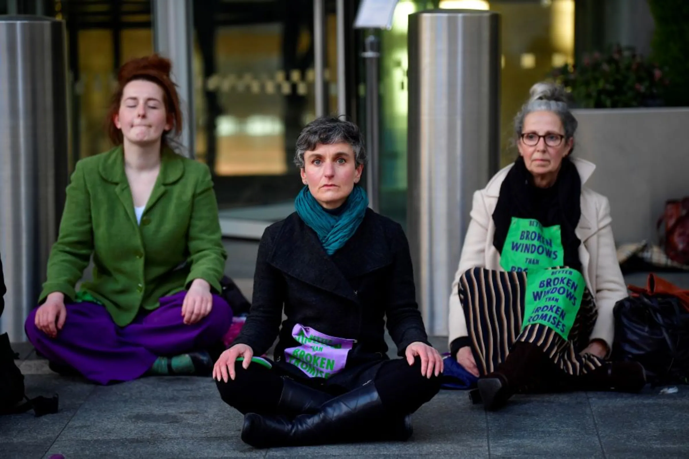 Activists from Extinction Rebellion, a global environmental movement, take part in a direct action at Barclays offices in Canary Wharf, London, Britain, April 7, 2021. REUTERS/Toby Melville