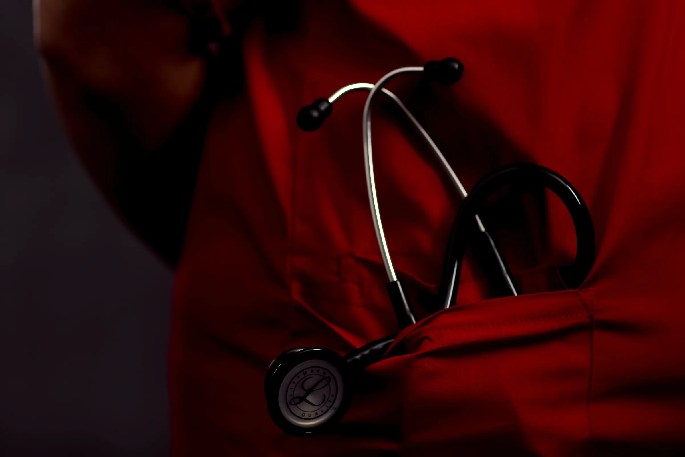 A nurse's stethoscope in the pocket of her uniform at The Royal Blackburn Teaching Hospital in north west England, Britain, March 3, 2021. REUTERS/Hannah McKay