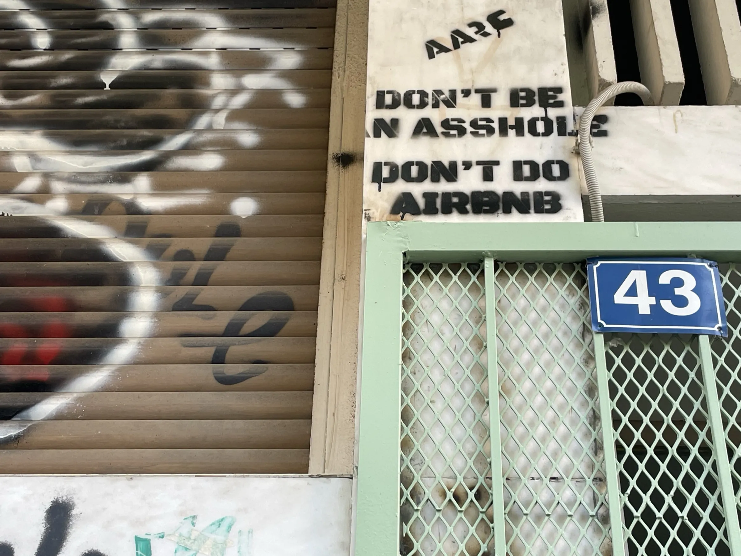 Anti-tourism slogans are graffitied on buildings in the Exarcheia neighbourhood, Athens, Greece. July 31, 2024. Thomson Reuters Foundation/Beatrice Tridimas