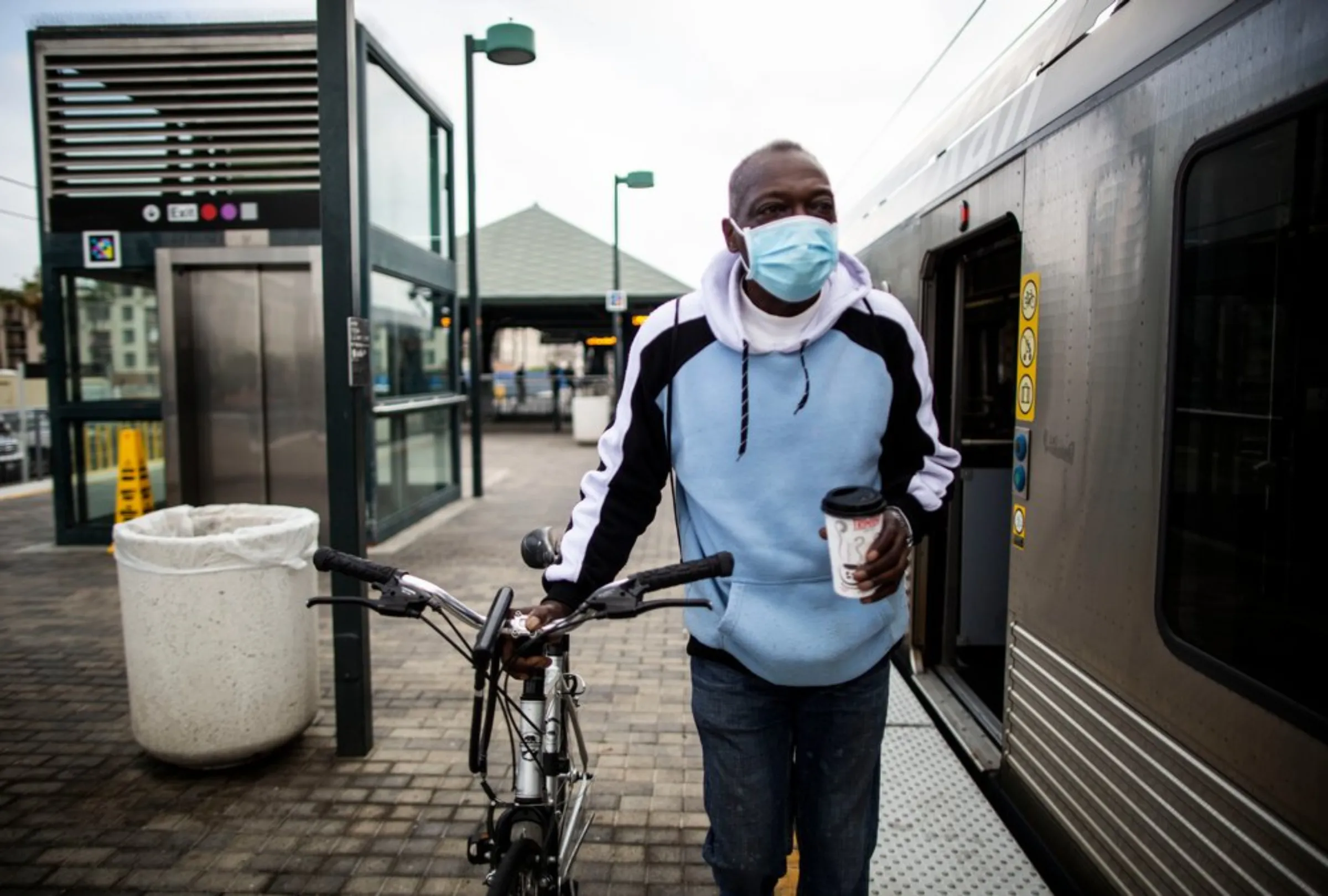 Los Angeles resident Ron Rogers boards a train with his bicycle at Union Station, as part of Bike to Work Week in Los Angeles, California, May 18, 2021