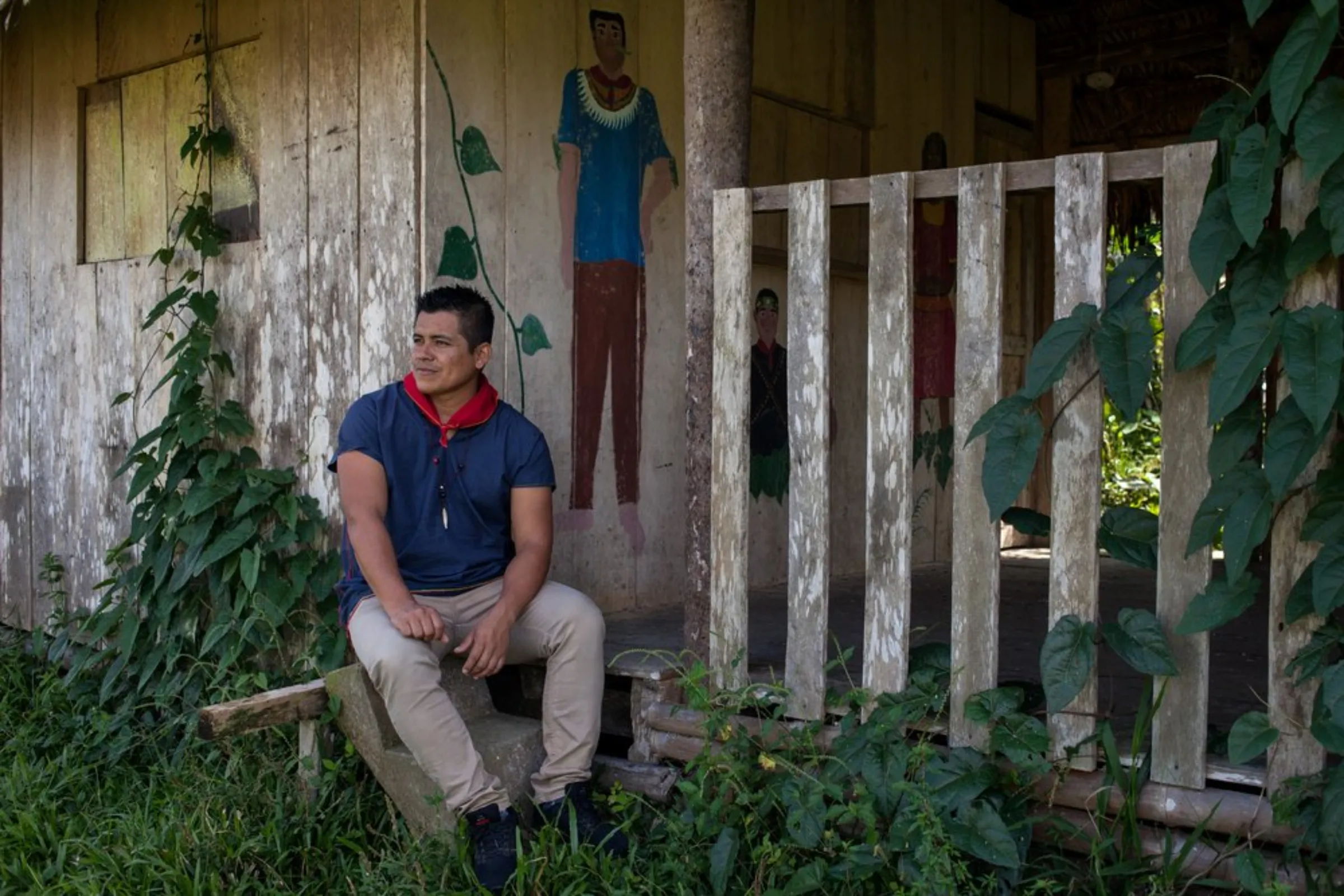 Cofan indigenous leader Wider Guaramag, part of a six-member elected committee that makes laws and guides the community, rests at the rainforest village of Sinangoe in northern Ecuador, on April 21, 2022