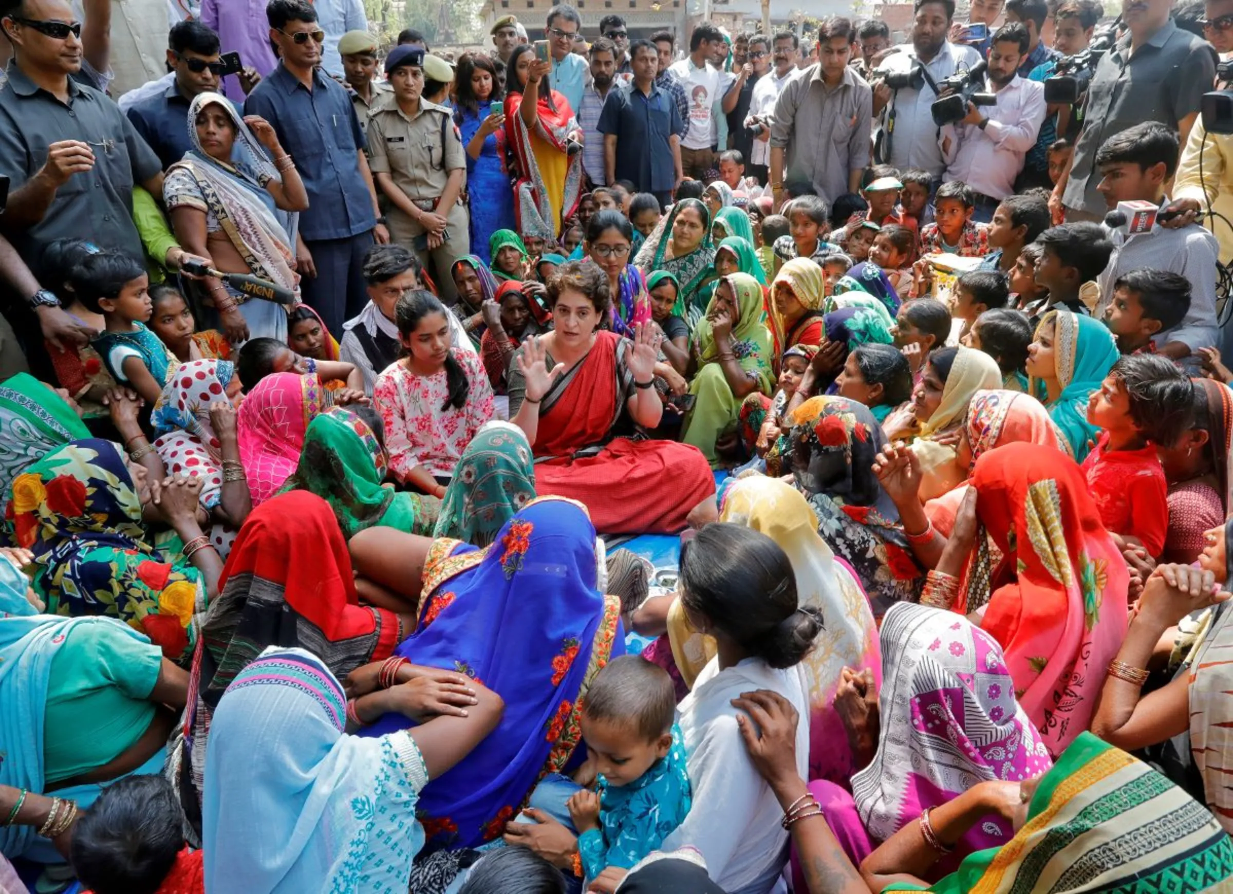 Priyanka Gandhi Vadra (C), a leader of India's main opposition Congress party speaks with women during an election campaign meeting in Ayodhya, India, March 29, 2019