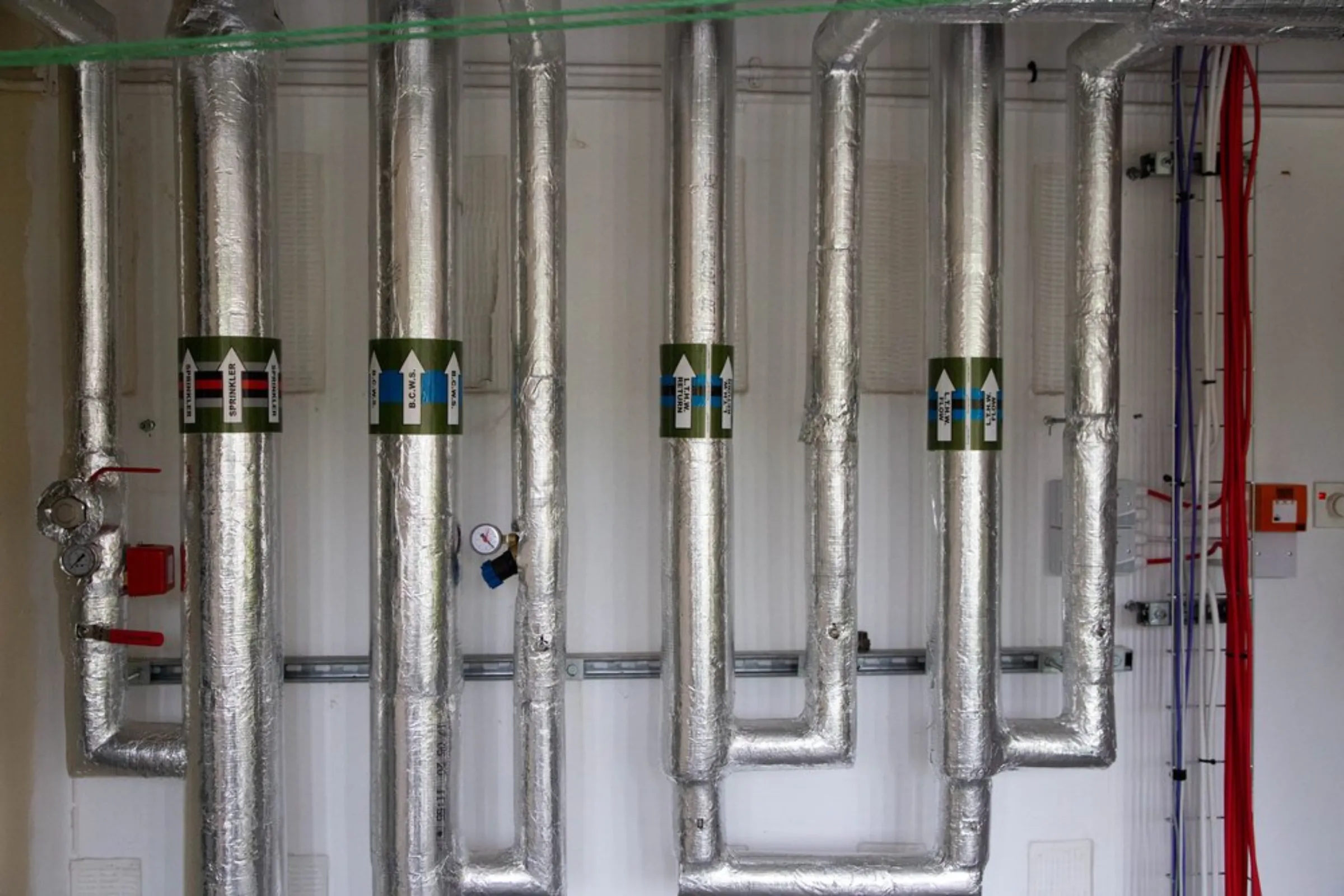 A view of pipes installed as part of a new system delivering green energy from heat pumps to homes at an estate in Glasgow, United Kingdom, July 22, 2021