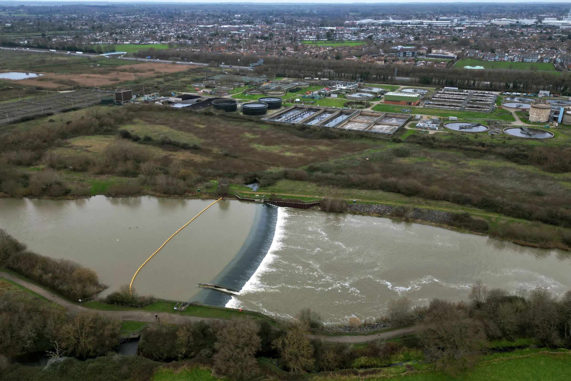 A drone photo shows a sewage treatment works, next to the River Thames in Slough, southern England, Britain, December 11, 2024. REUTERS/Dylan Martinez