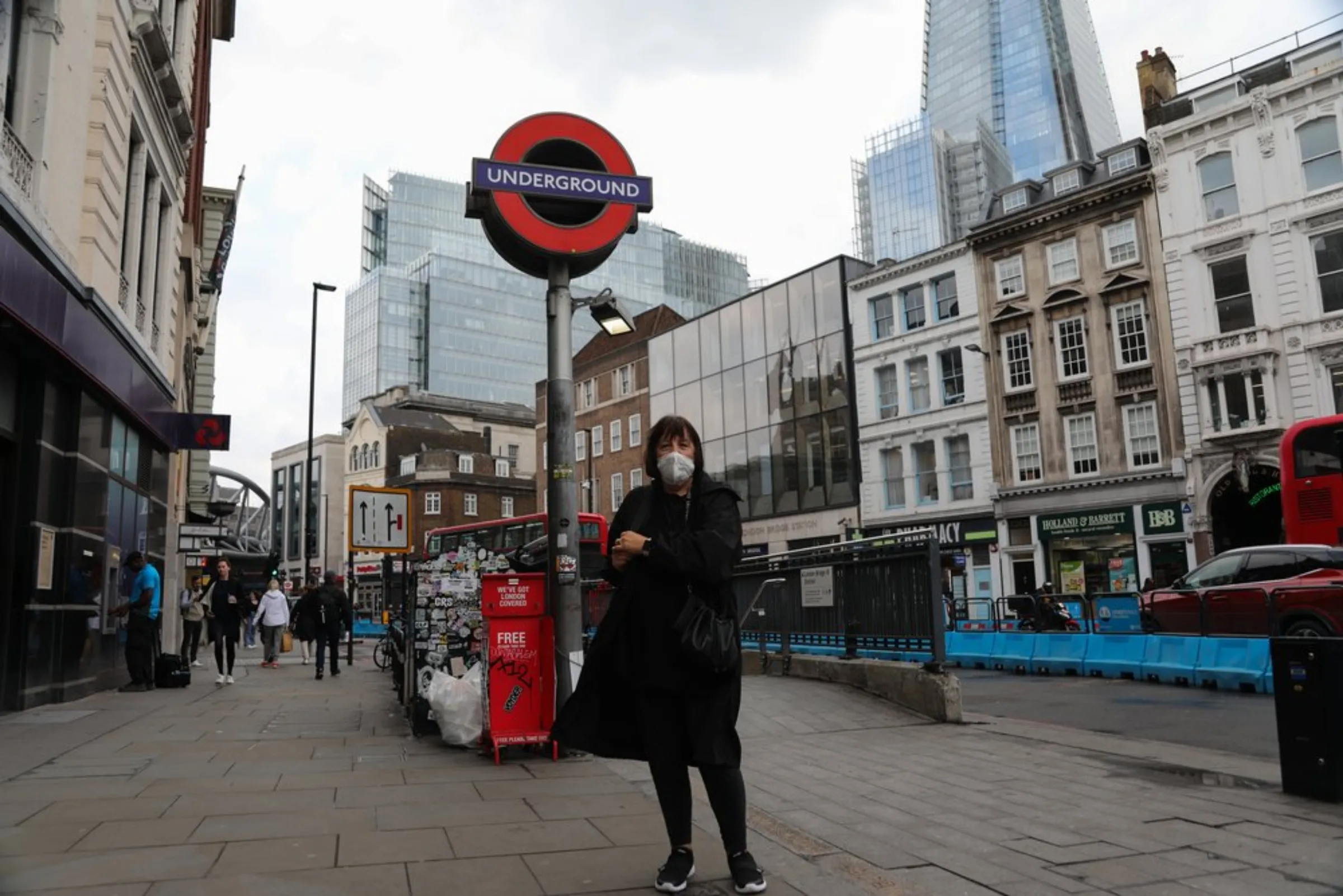 Evelyn Kalmar, 63, pauses outside London Bridge Underground Station on her way to her nearby gym in London, England, on October 19, 2021. If the line floods more frequently, “it would make London very difficult to move around and cause a lot of unrest if people are fighting to get on transport,” she said
