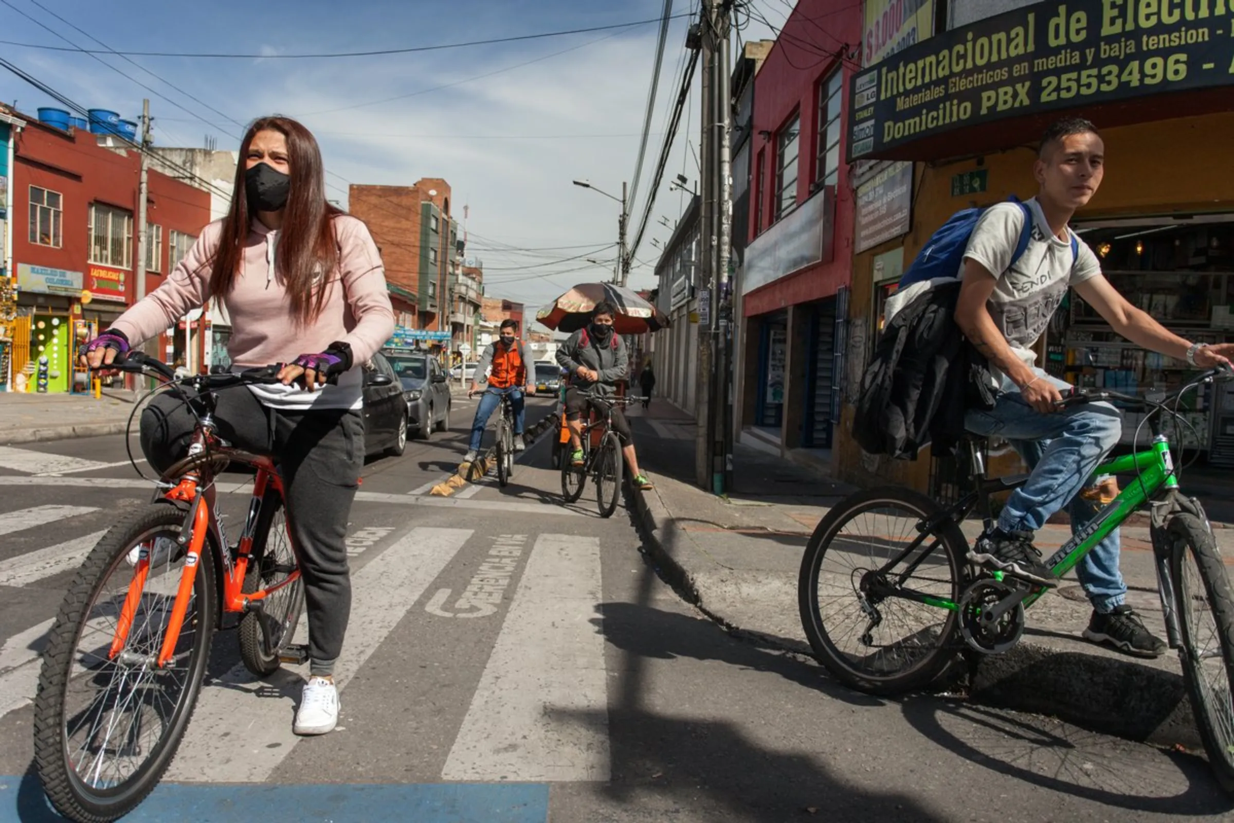 Cyclists ride in Bogota, Colombia, April 19, 2021. The city has expanded its already extensive network of cycle lanes during the coronavirus pandemic, to help provide a virus-safe means of transport