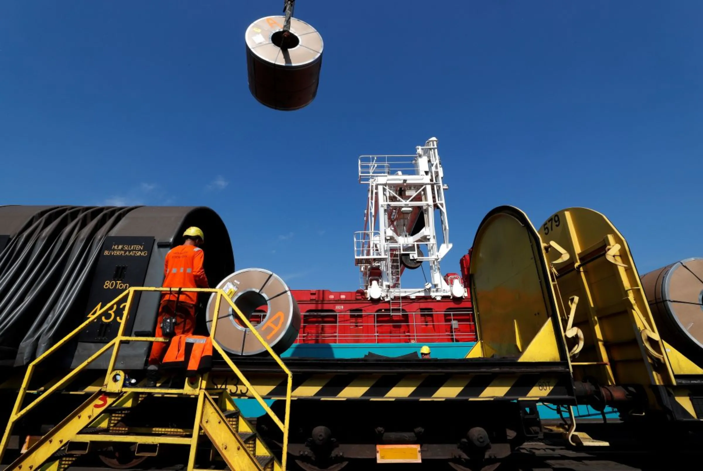 Metal coils are unloaded from a train at the ArcelorMittal steel plant in Ghent, Belgium, May 22, 2018