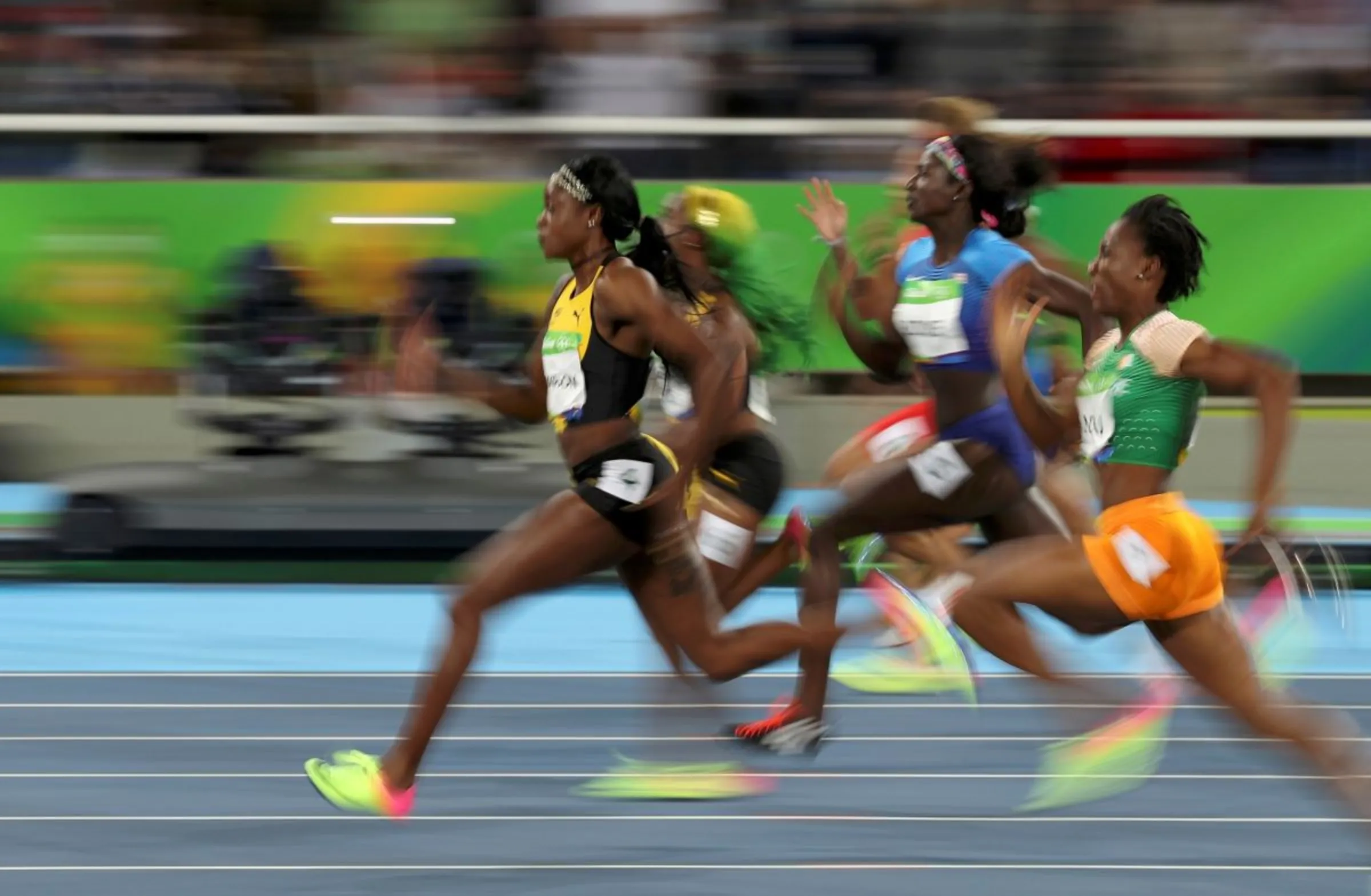 2016 Rio Olympics - Athletics - Final - Women's 100m Final - Olympic Stadium - Rio de Janeiro, Brazil - 13/08/2016. Elaine Thompson (JAM) of Jamaica leads as she races to win the gold. REUTERS/Phil Noble