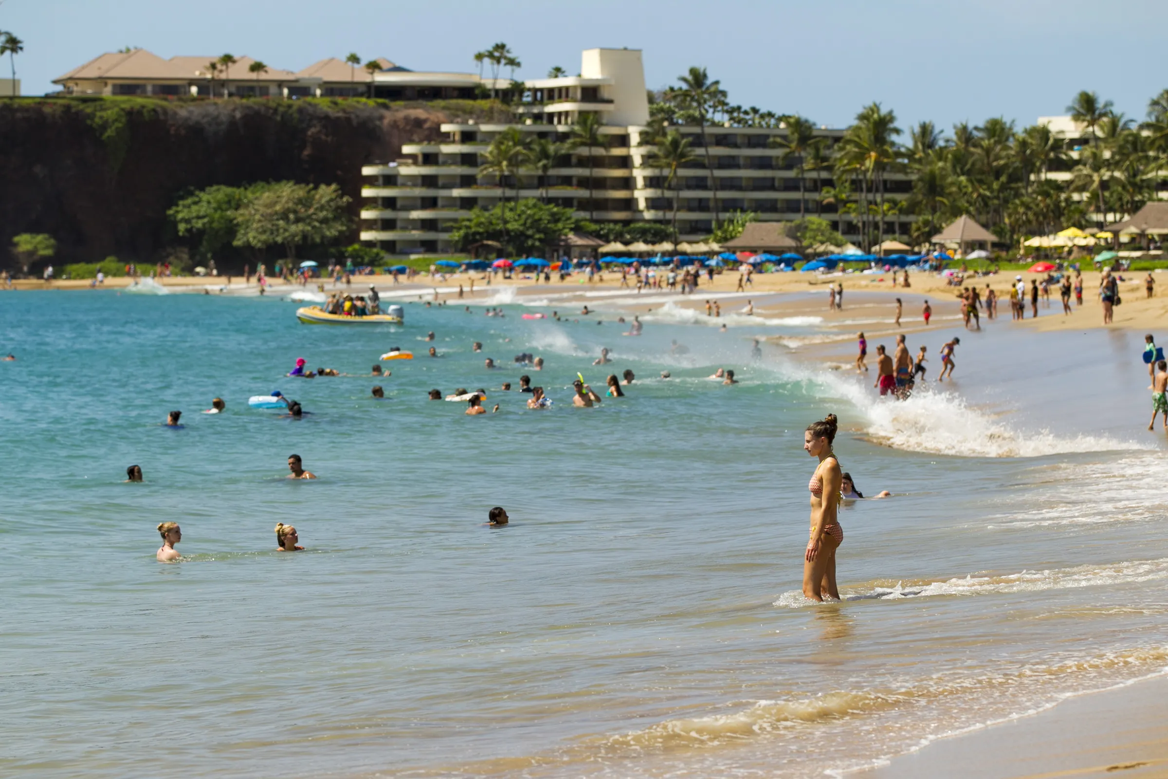 Beachgoers enjoy the surf on the beach in Lahaina, Maui, Hawaii July 28, 2015. REUTERS/Marco Garcia