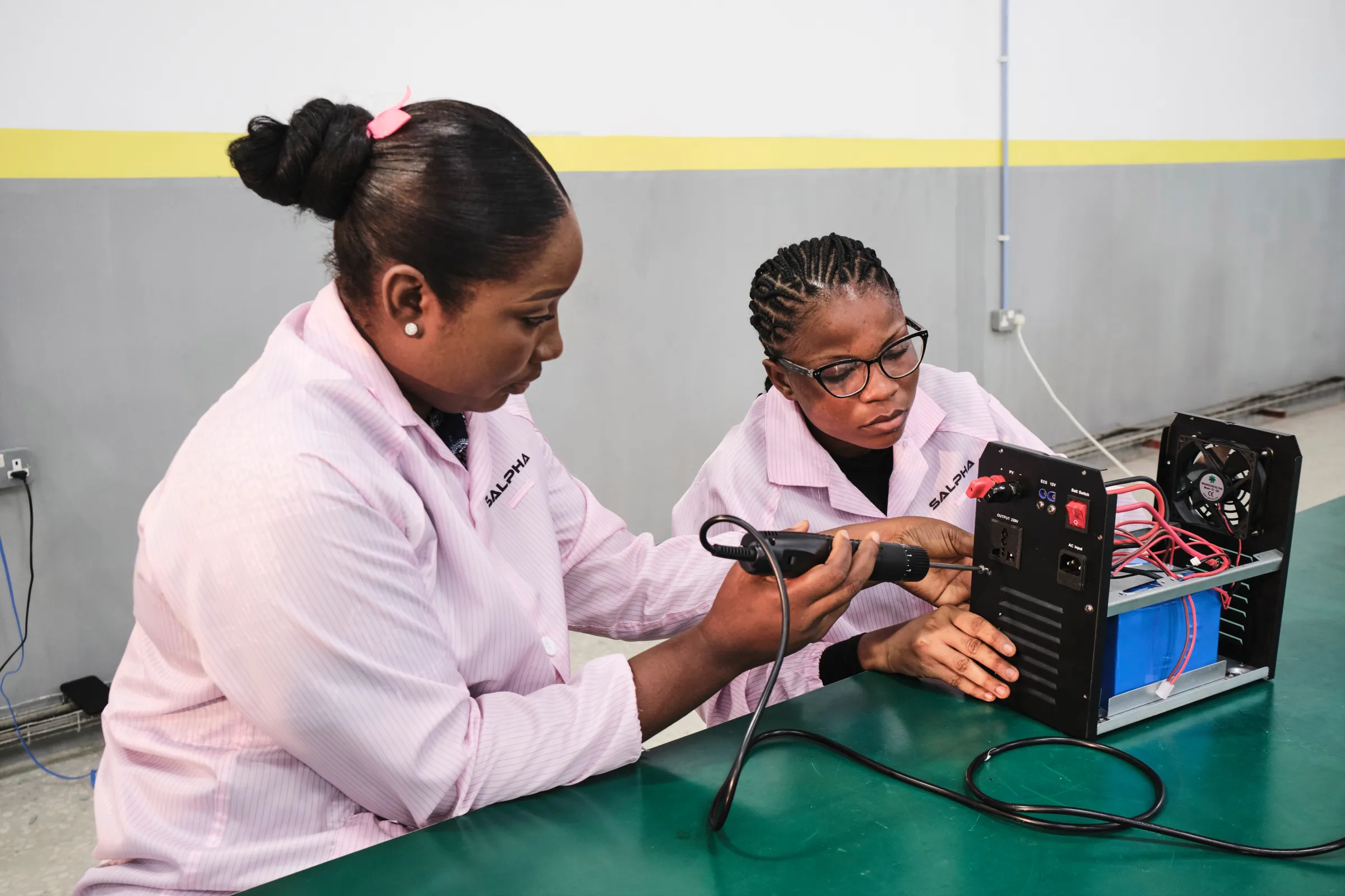 Female engineers at her solar assembly factory in Cross River, Nigeria, in 2024. Emeka Iko/Ashden Climate Solutions/Handout via Thomson Reuters Foundation.