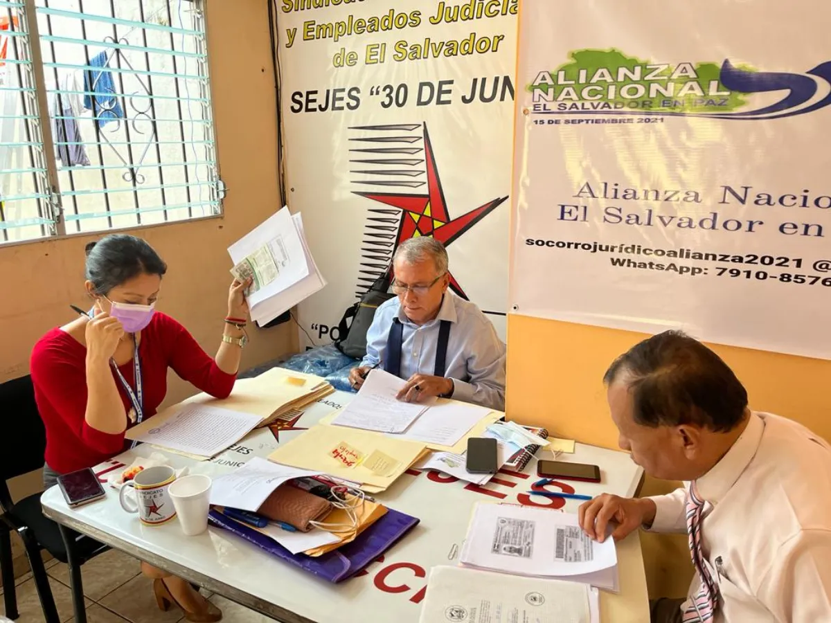 Pro-bono lawyers from the Judicial Workers Union (SEJES) work on cases presented by families whose relatives have been arrested during the crackdown on gang violence
