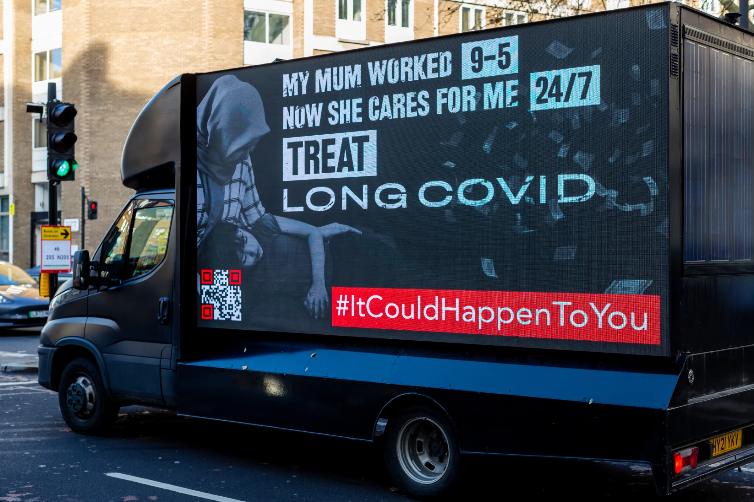 A truck raising awareness of long COVID in children is seen during a protest in London in Dec 2023. Long Covid Kids/Handout via Thomson Reuters Foundation