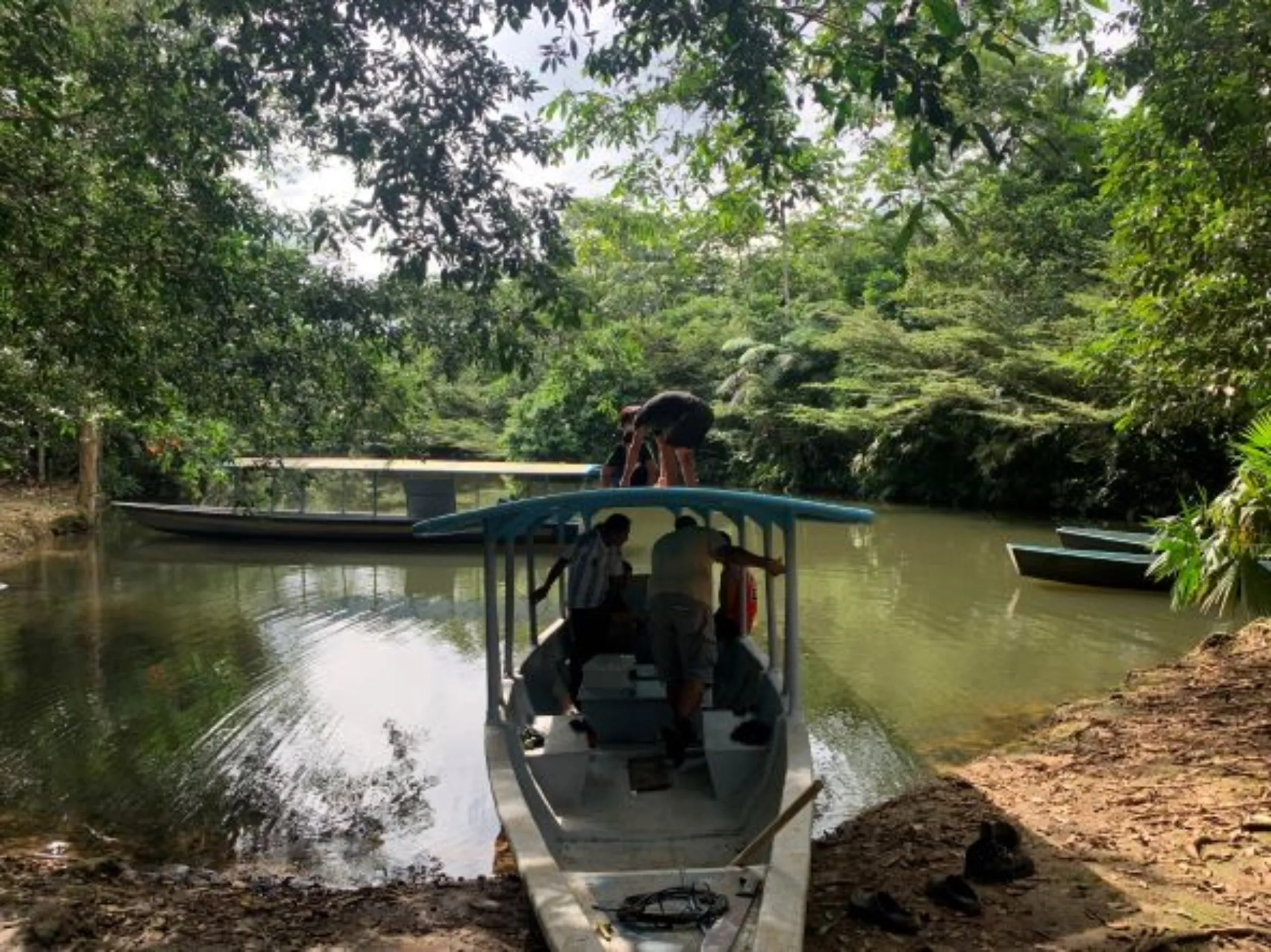 A group of Kara Solar technicians work on a new solar-panel-powered river boat near Tena, Ecuador