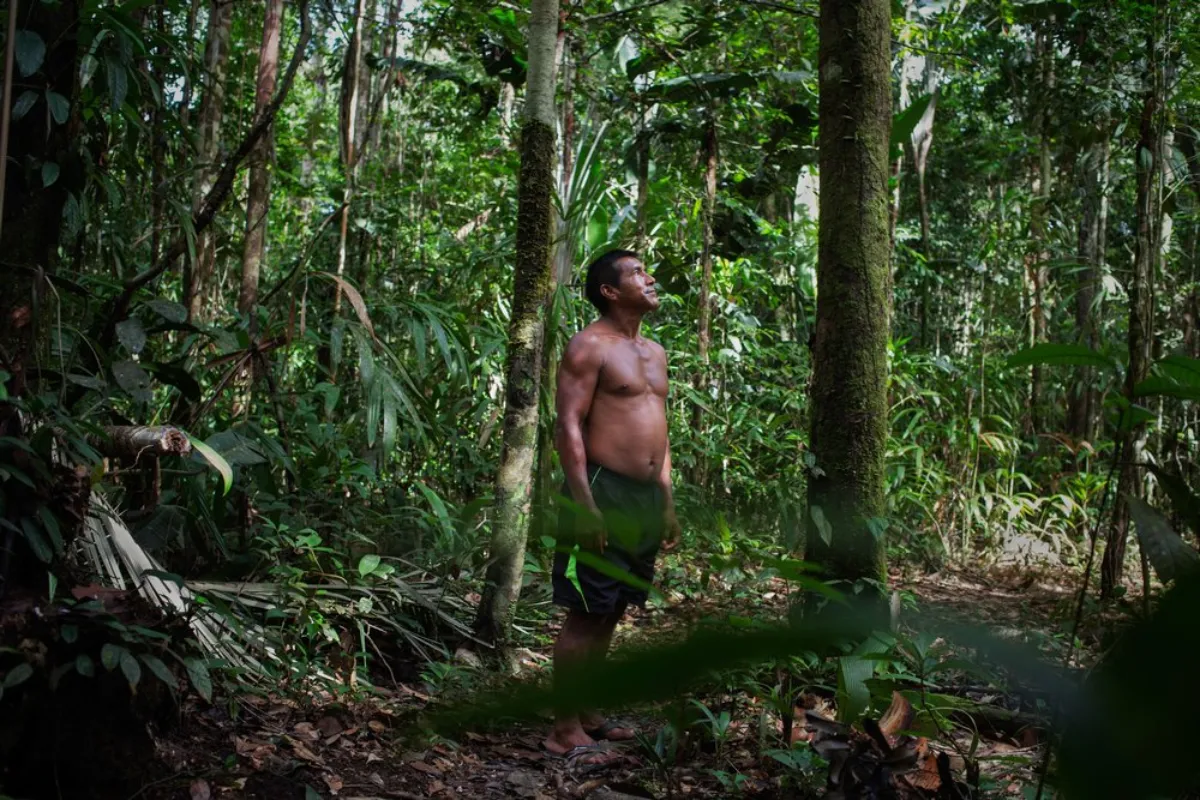 Lucio Matapi, 'captain' of the Puerto Libre community, stands in dense tropical rainforest near his community living along the Miriti-Parana River in Colombia’s southeast Amazonas province, December 16, 2021