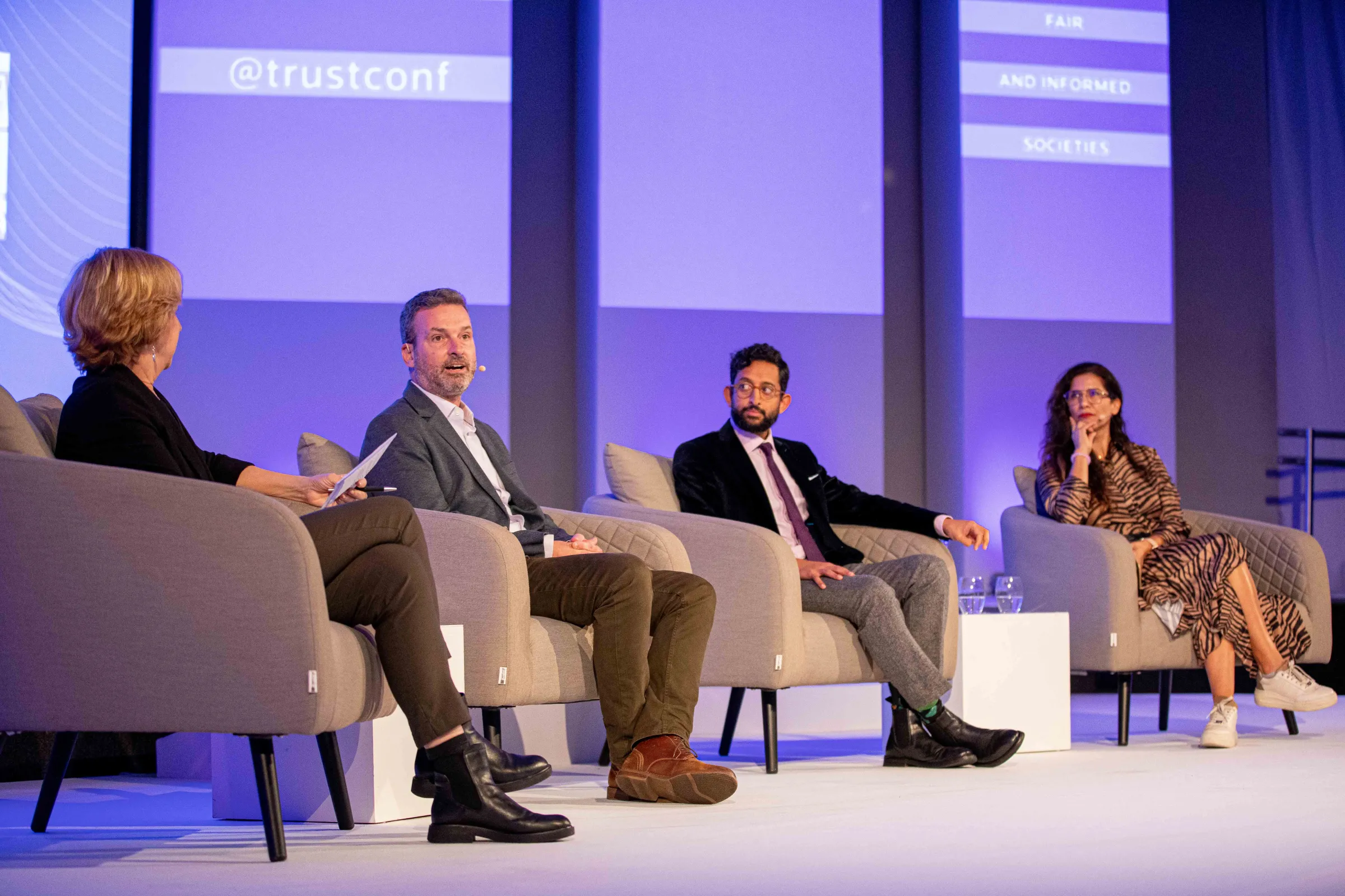 Panelists David Carroll, associate professor of media design at Parsons School of Design, Ravi Naik, legal director of AWO and Ursula O'Kuinghttons, director of communications at the Swiss based Web3 Foundation speak with moderator Vivian Schiller, executive of the Aspen Institute at a discussion on data rights at the 2022 Trust Conference, London, 26 October 2022. Thomson Reuters Foundation/Ed Telling