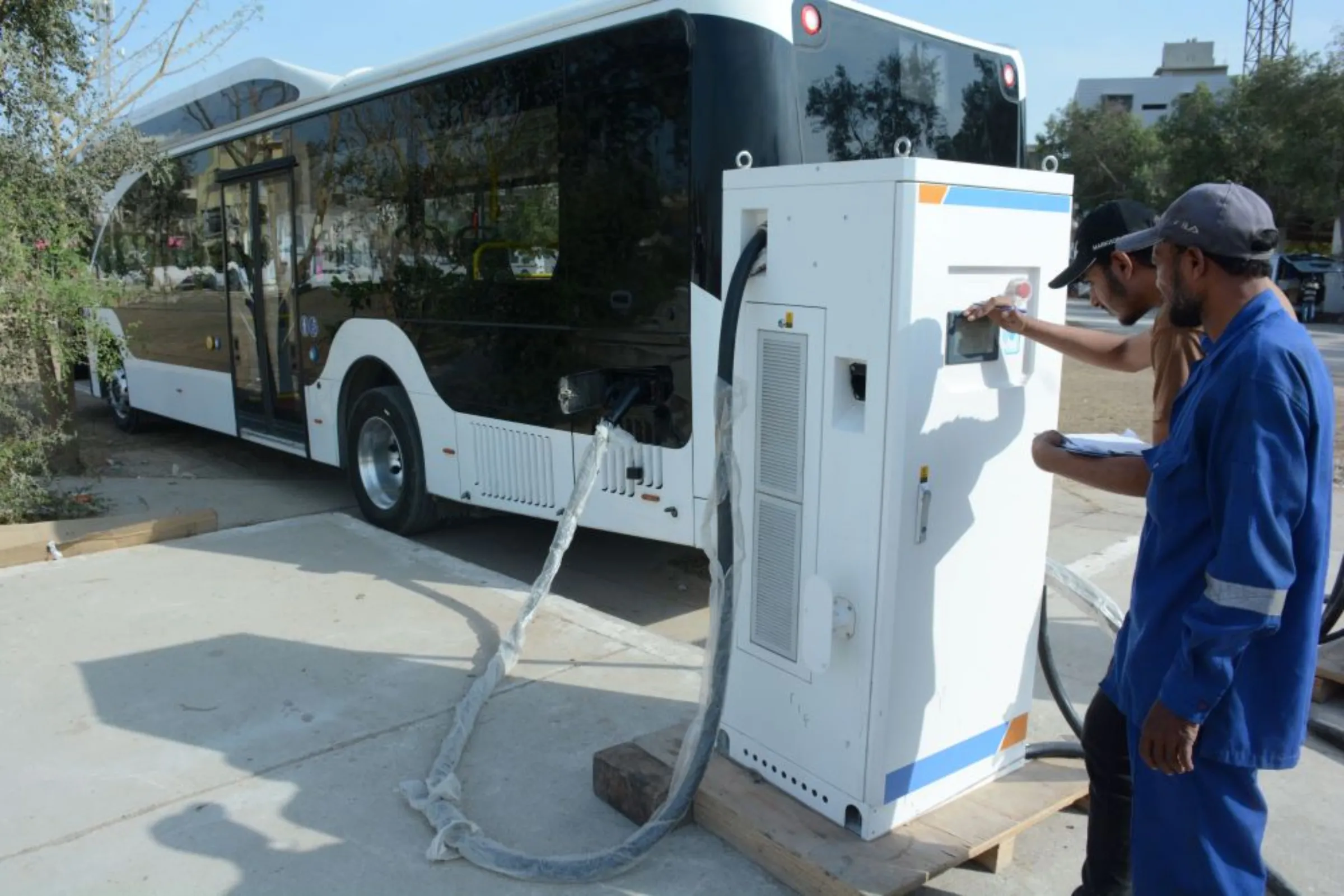 An electric bus is being charged at a charging station in Mehran Bus Depot in the neighbourhood of Malir, Karachi, the capital of Pakistan’s southeastern Sindh province, March 2, 2023