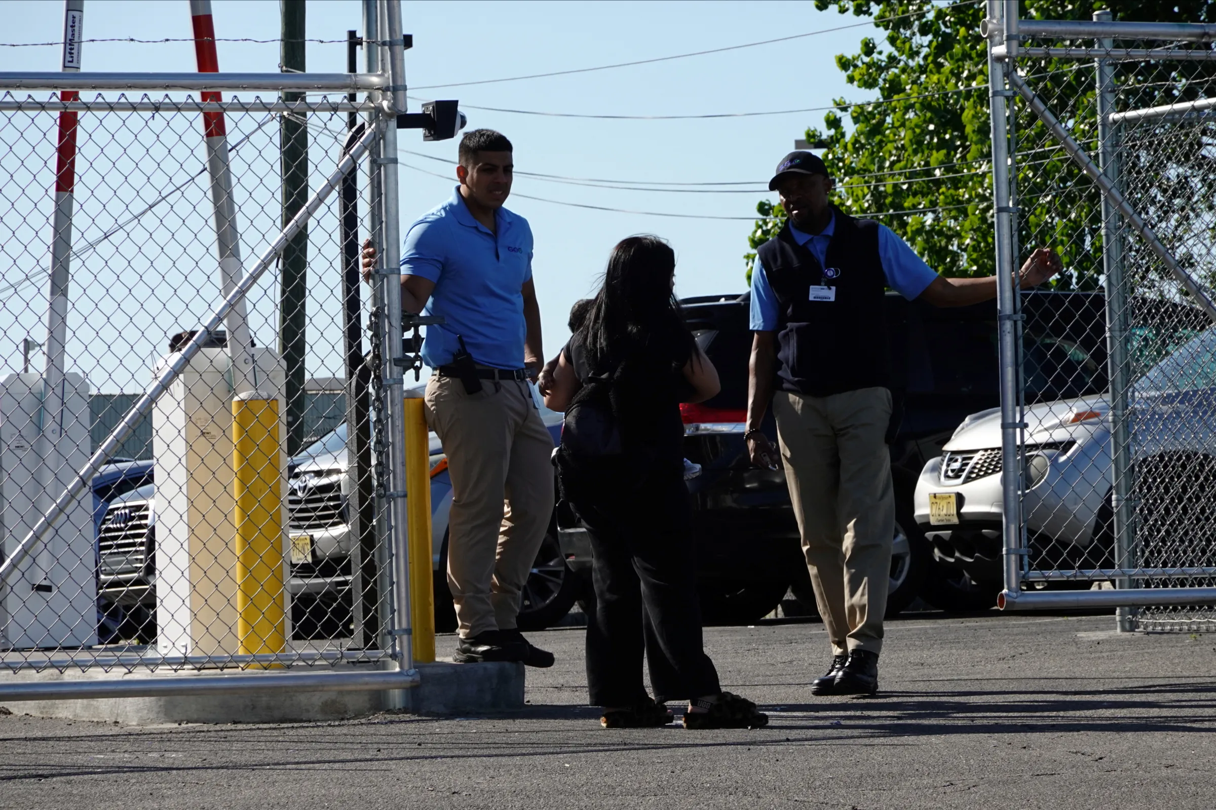 GEO Group employees speak with a woman carrying a baby, at Delaney Hall, operated by private prison company GEO Group for Immigration and Customs Enforcement (ICE), in Newark, New Jersey, U.S., May 10, 2025. REUTERS/Bing Guan