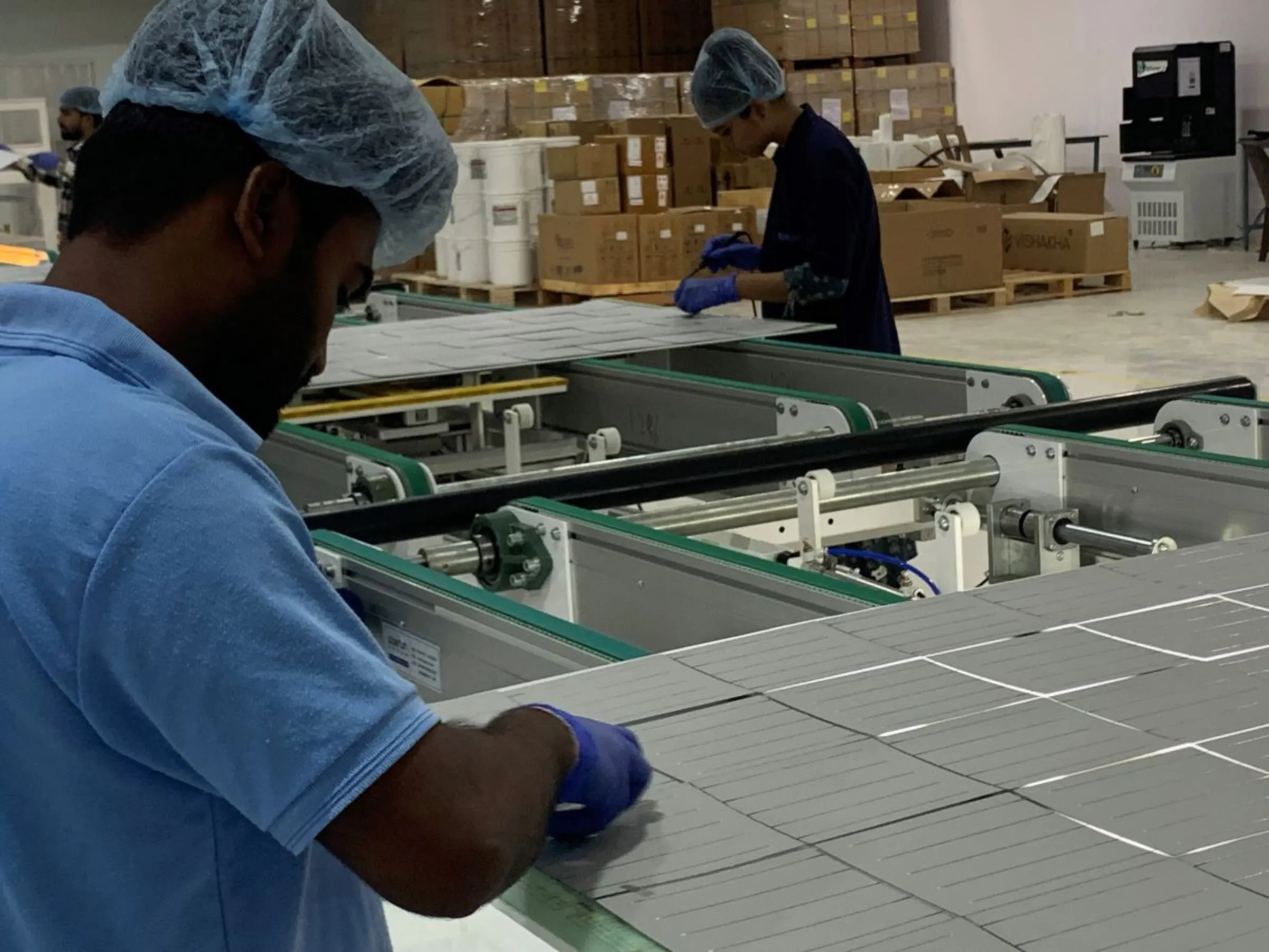 Employees at work at Sunbond Energy Pvt Ltd, a solar-panel manufacturing factory in Mitana village in western Gujarat, India, May 29, 2023. Thomson Reuters Foundation/Anuradha Nagaraj
