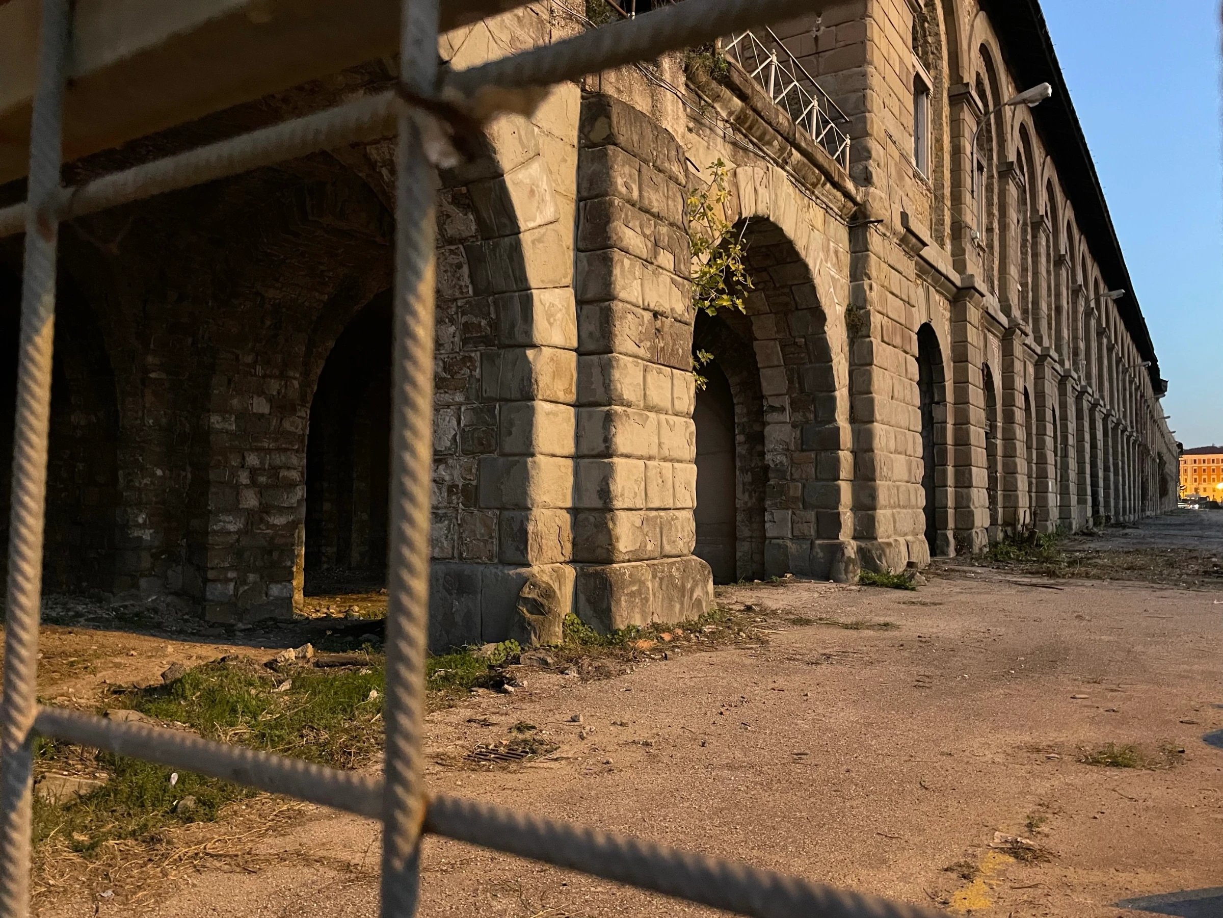 Abandoned warehouses next to Trieste Centrale railway station where people on the move used to camp before the buildings were fenced off in June 2024, in Trieste, Italy. November 13, 2024. Thomson Reuters Foundation/Beatrice Tridimas