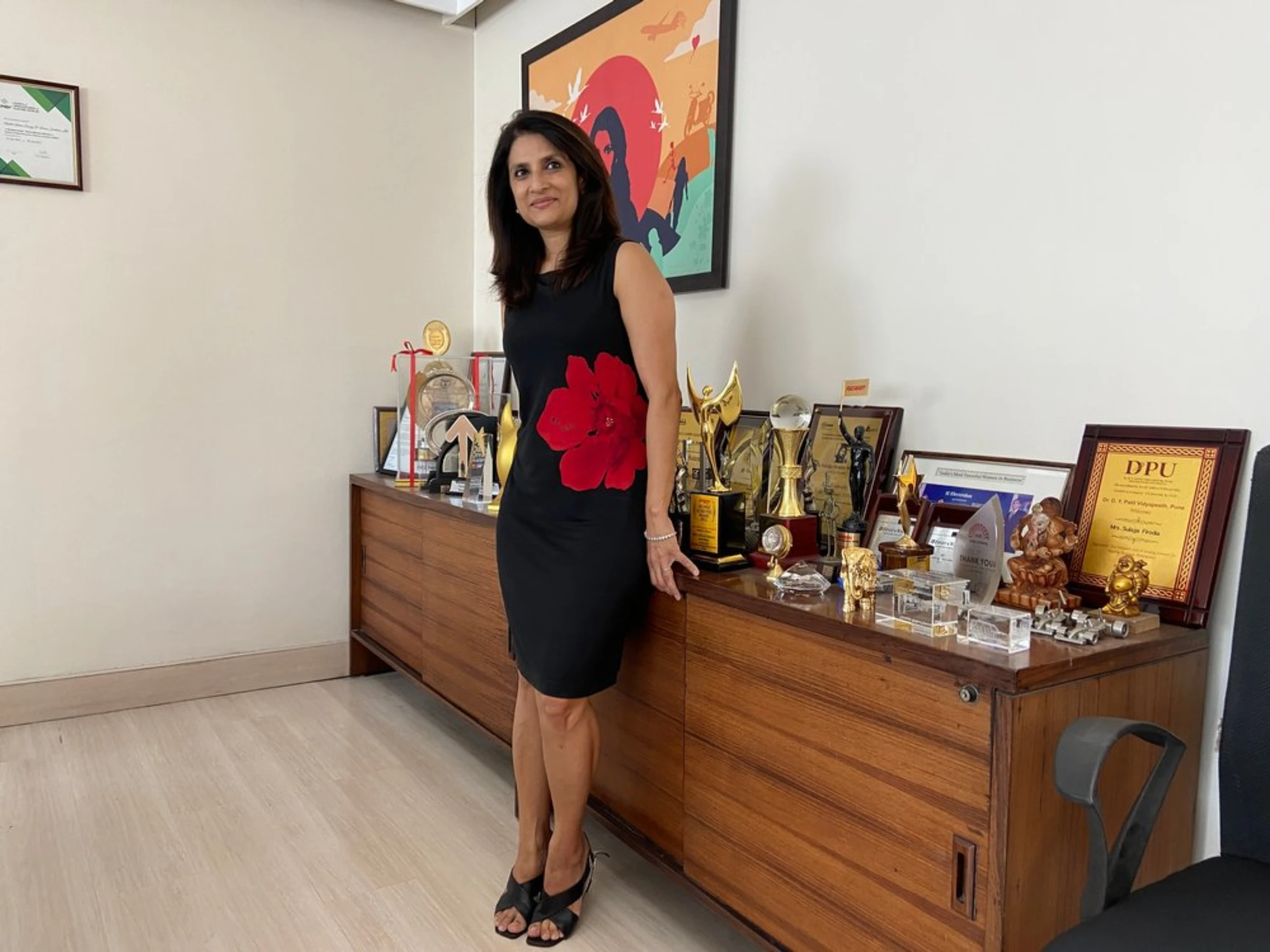 Sulajja Firodia Motwani, founder and CEO of Kinetic Green, poses alongside awards she has won, in her office in Pune, India, April 20, 2022