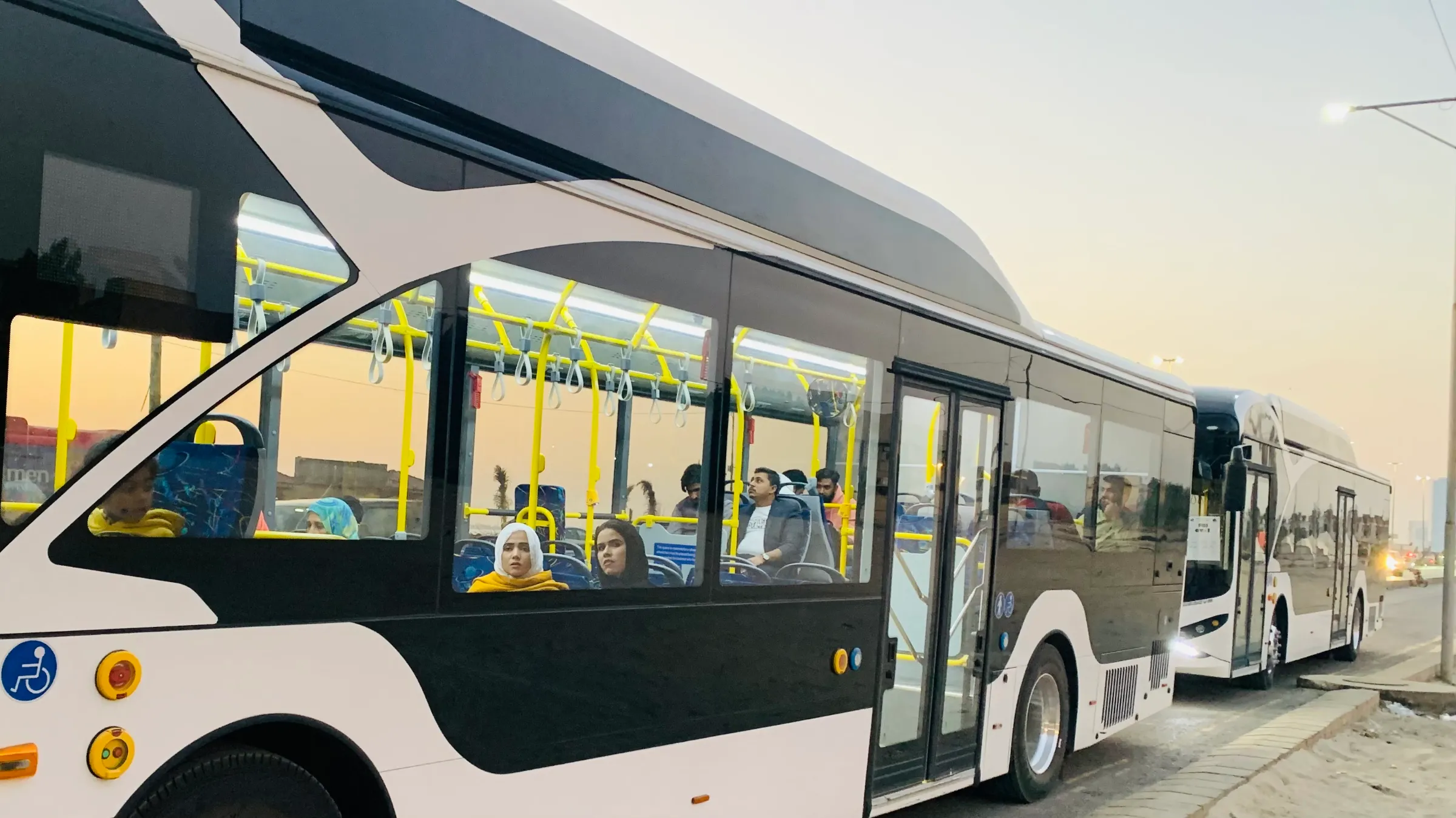 An electric bus waits for more passengers at the Sea View stop in the neighbourhood of Defence Housing Authority (DHA), Karachi, Pakistan, January 14, 2023