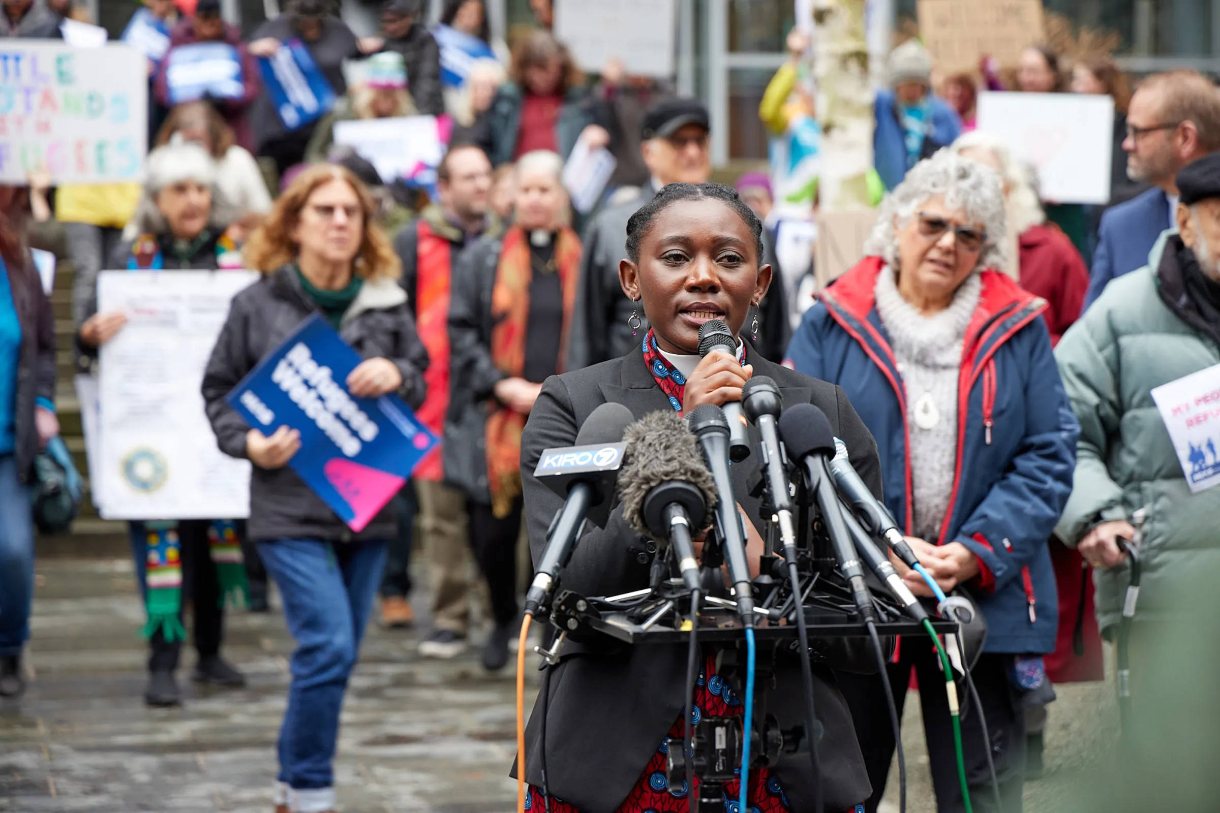 The Rev. Emillie Binja addresses a February 25 rally outside a Seattle courthouse on a lawsuit over the federal government’s halting the U.S. refugee program. Stewart Tilger/International Refugee Assistance Project/Handout via Thomson Reuters Foundation