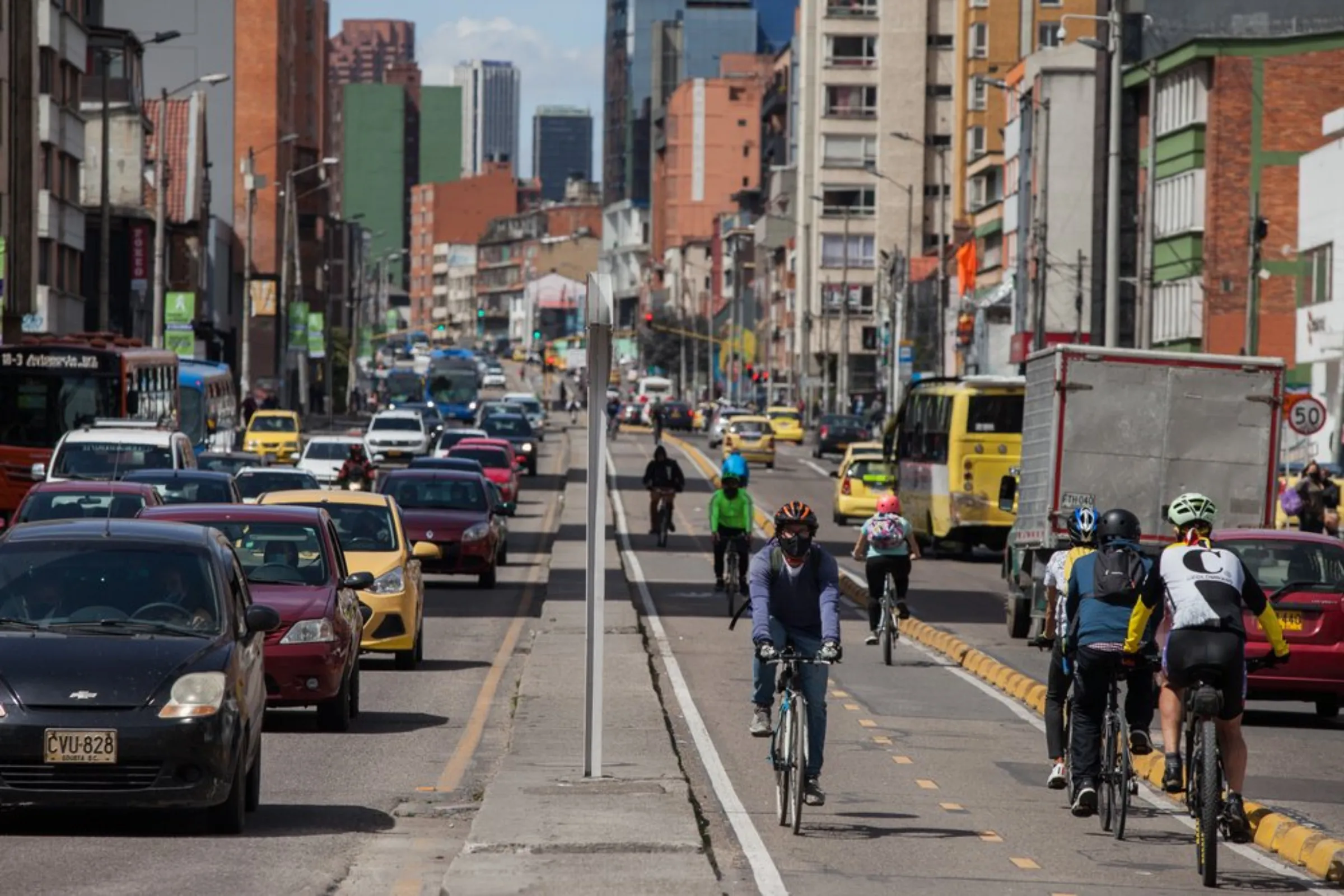 Cyclists ride on separated cycle lanes in Bogota, Colombia, April 19, 2021