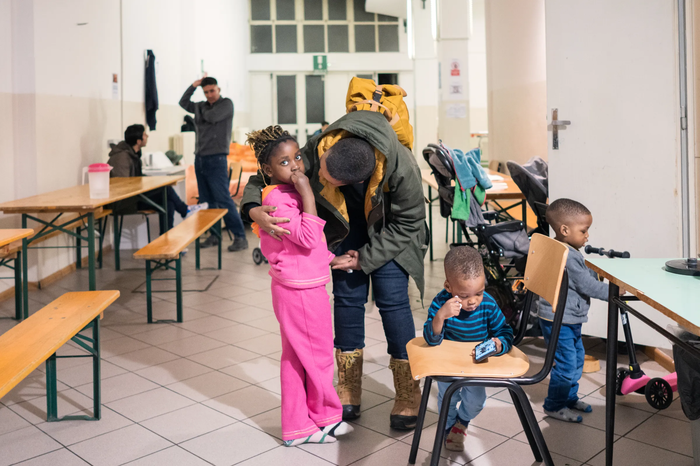 Children play in an emergency dormitory for people on the move in Trieste, Italy. March 4, 2024. Francesco Pistilli/International Rescue Committee/Handout via Thomson Reuters Foundation