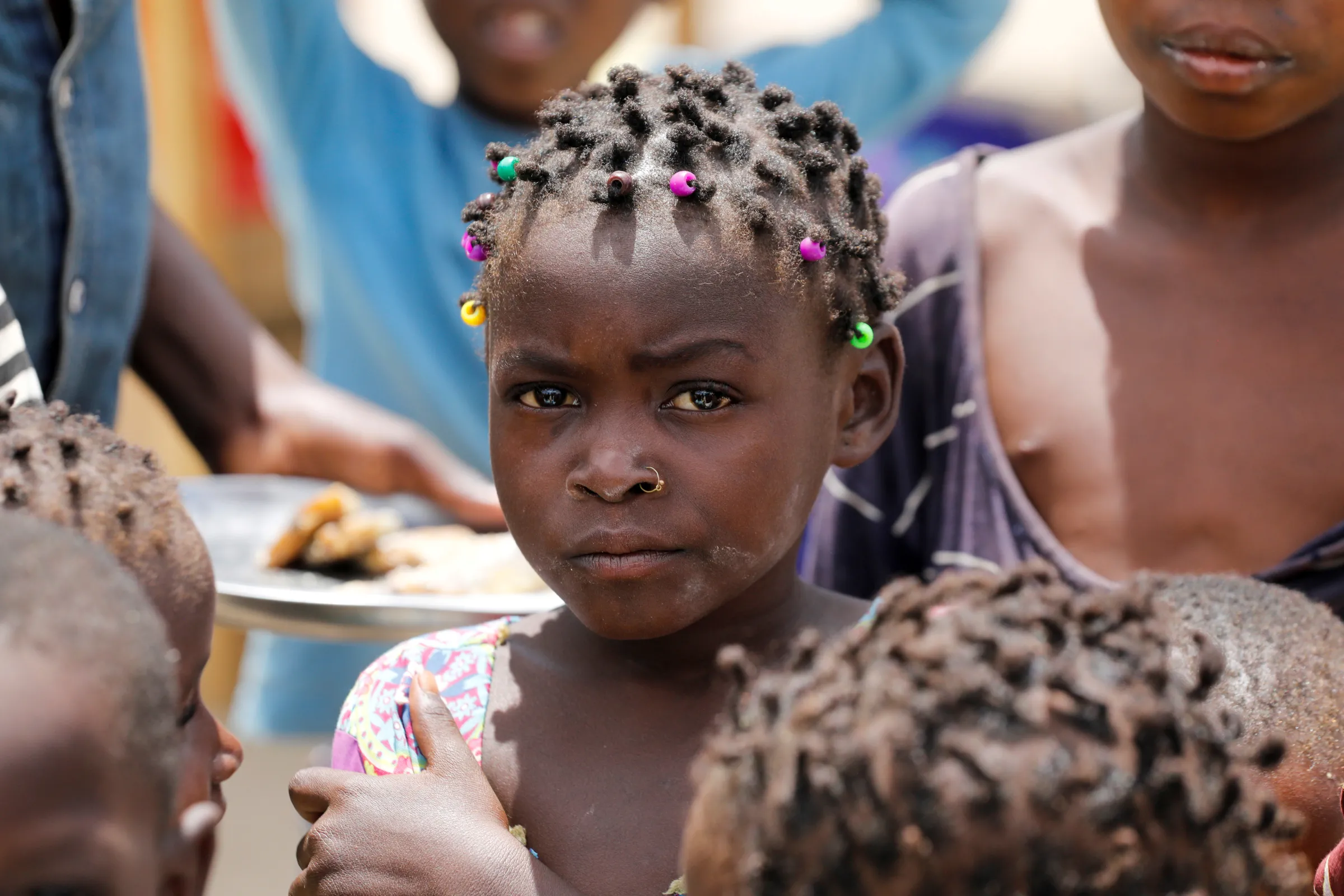 A girl looks on inside a camp for the internally displaced in the town of Quitunda, Mozambique September 22, 2021. REUTERS/Baz Ratner
