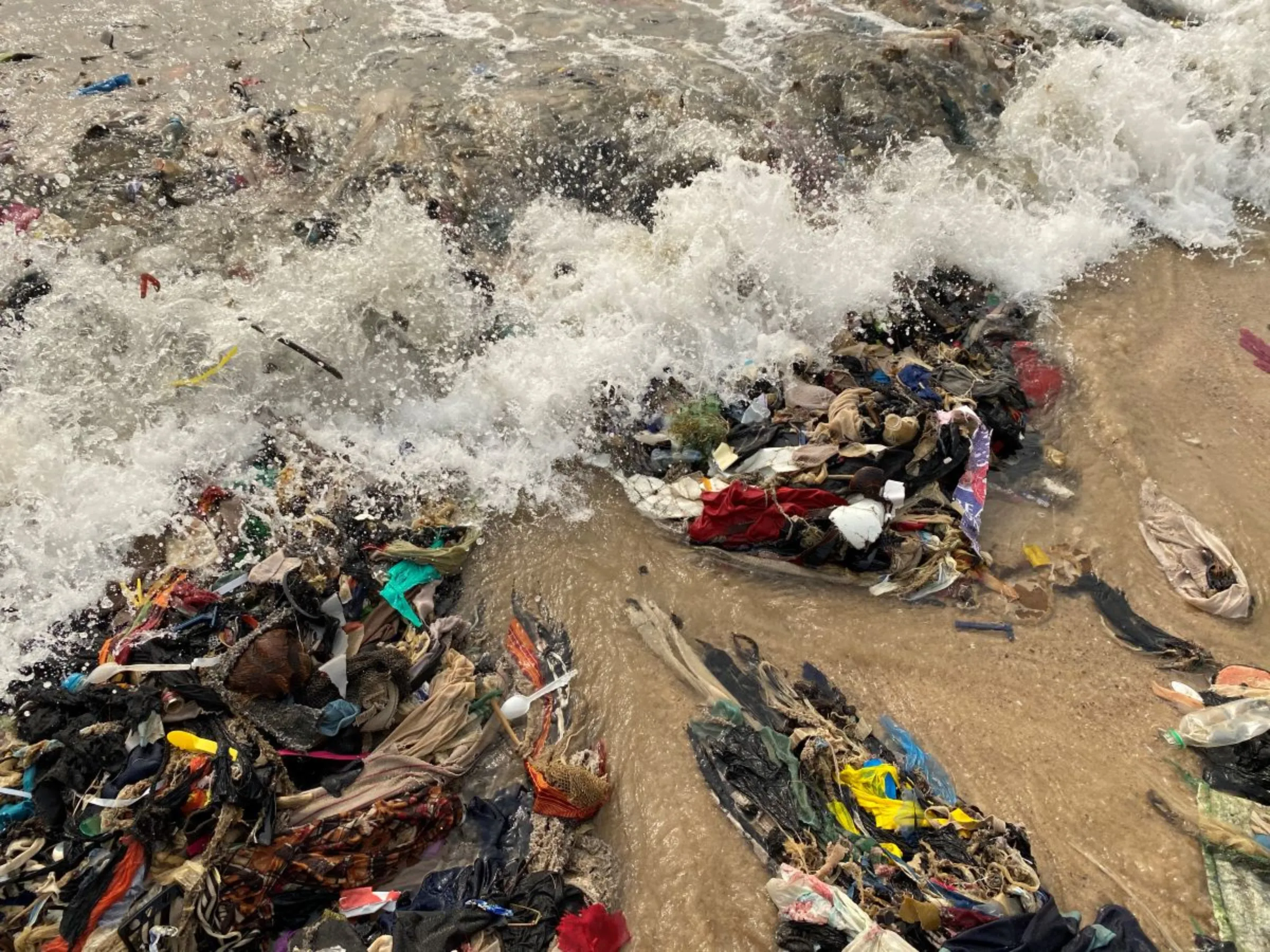 Clothing that cannot be sold by Kantamanto traders ends up on Osu Beach in Accra, Ghana. Global Fashion Agenda/Global Fashion Summit 2023/Handout via Thomson Reuters Foundation