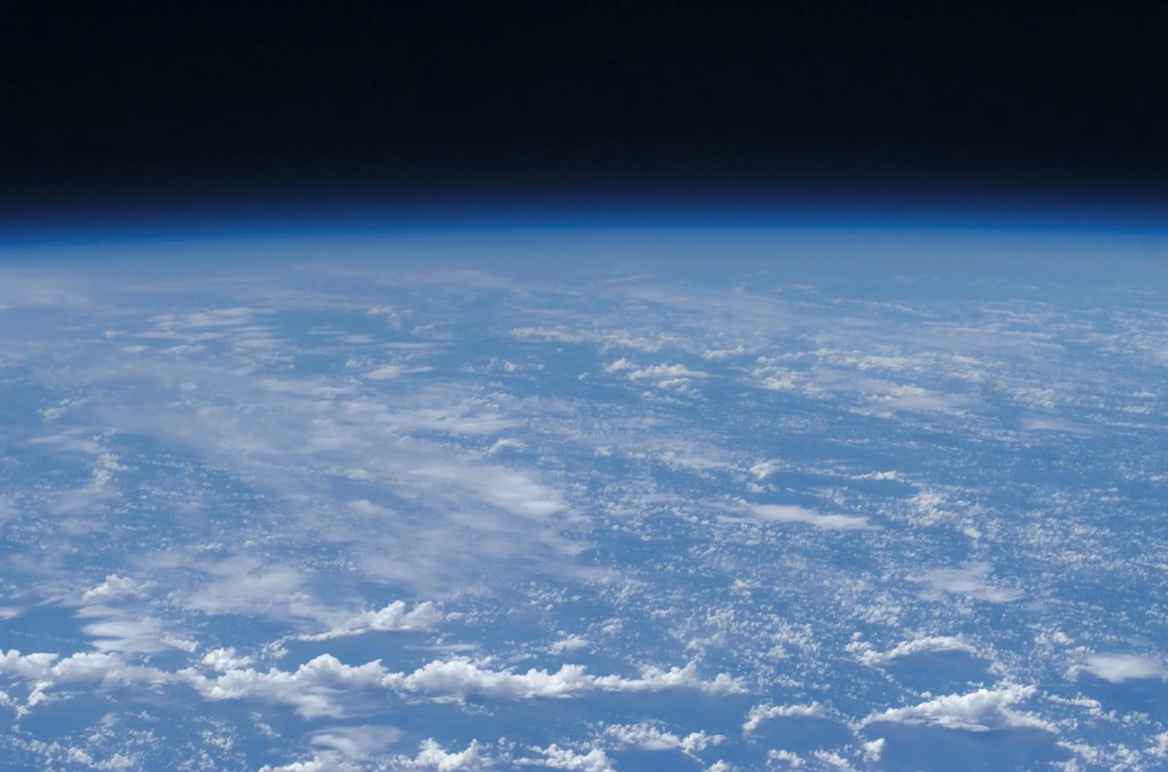 This is an oblique horizon view taken from the International Space Station at 220 miles above Earth clearly showing the planet's atmosphere in this NASA handout photo taken July 22, 2009. NASA/Handout via Reuters